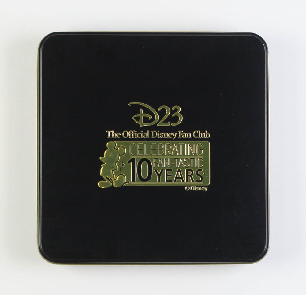 D23 The Official Disney Fan Club 10th Anniversary Complete Set of (10) Extra-Large Pins with Tin Box at PristineAuction.com D23 The Official Disney Fan Club 10th Anniversary Complete Set of (10) Extra-Large Pins with Tin Box at PristineAuction.com