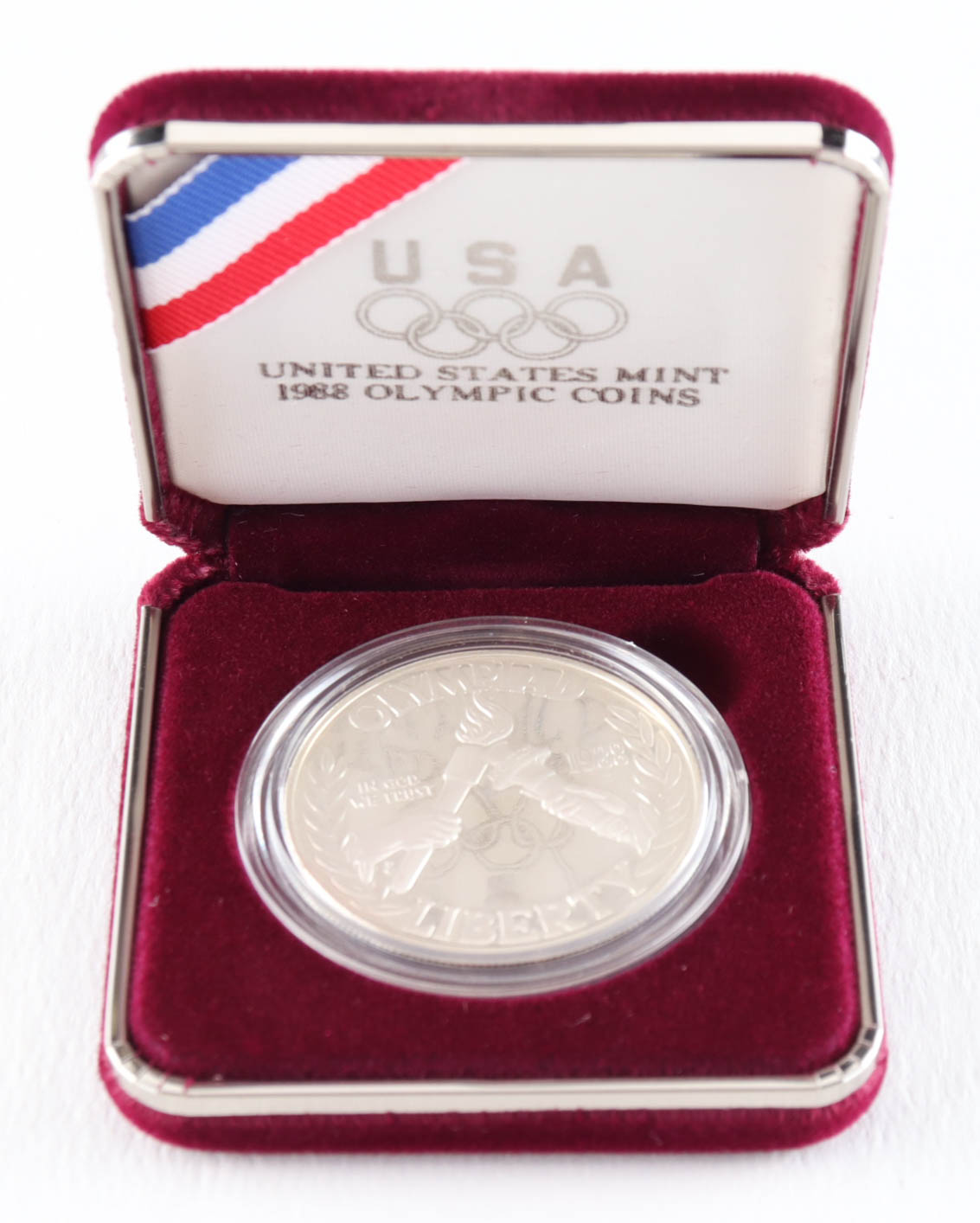 1988-S $1 One Dollar Olympiad Liberty Commemorative Silver Bullion Round at PristineAuction.com 1988-S $1 One Dollar Olympiad Liberty Commemorative Silver Bullion Round at PristineAuction.com