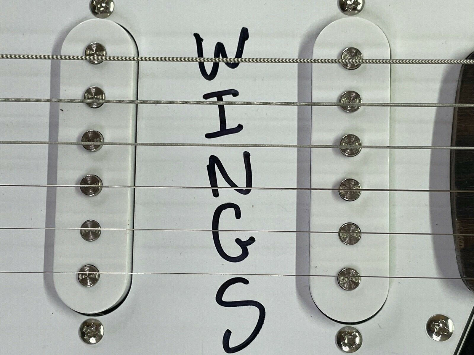 Denny Laine & Steve Holley Signed Wings Logo Electric Guitar Inscribed "Wings" (JSA) at PristineAuction.com Denny Laine & Steve Holley Signed Wings Logo Electric Guitar Inscribed "Wings" (JSA) at PristineAuction.com