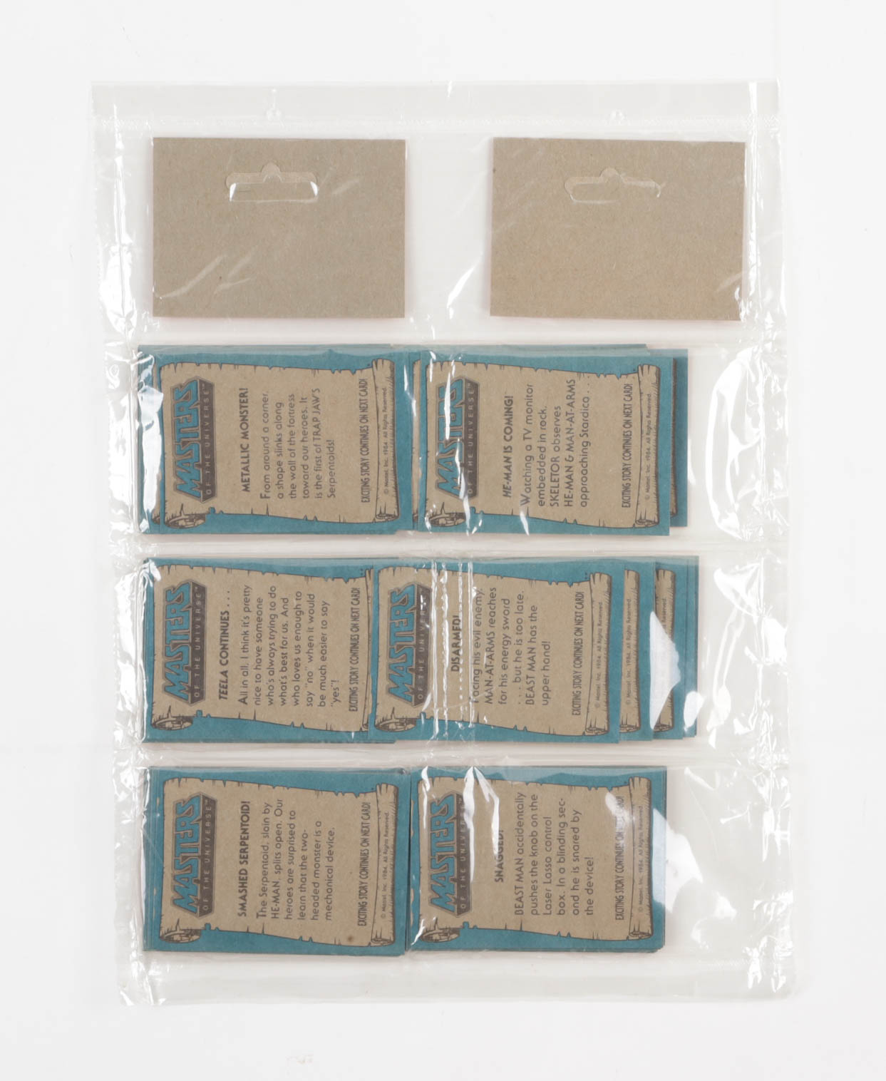 1984 Topps Masters of The Universe Double Rack Pack with (90) Cards at PristineAuction.com 1984 Topps Masters of The Universe Double Rack Pack with (90) Cards at PristineAuction.com