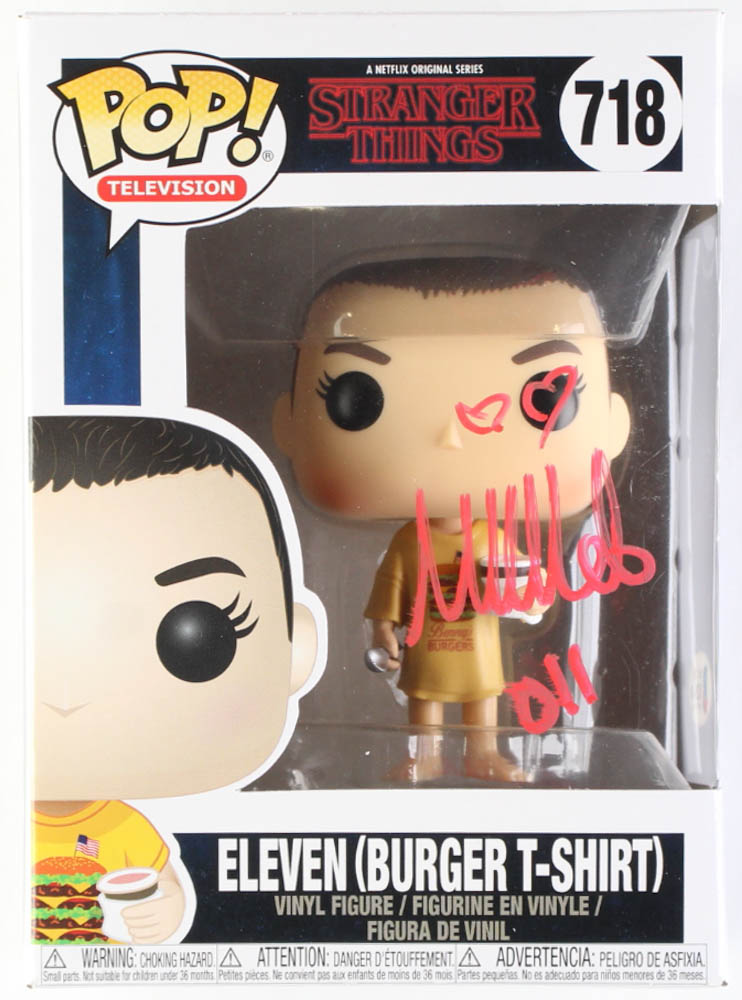 Millie Bobby Brown Signed "Stranger Things" #718 Eleven (Burger T-Shirt) Funko Pop! Vinyl Figure Inscribed "011" (Beckett) at PristineAuction.com Millie Bobby Brown Signed "Stranger Things" #718 Eleven (Burger T-Shirt) Funko Pop! Vinyl Figure Inscribed "011" (Beckett) at PristineAuction.com