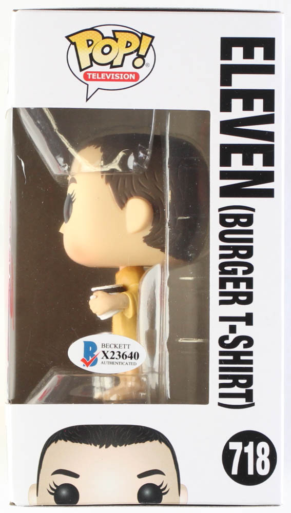 Millie Bobby Brown Signed "Stranger Things" #718 Eleven (Burger T-Shirt) Funko Pop! Vinyl Figure Inscribed "011" (Beckett) at PristineAuction.com Millie Bobby Brown Signed "Stranger Things" #718 Eleven (Burger T-Shirt) Funko Pop! Vinyl Figure Inscribed "011" (Beckett) at PristineAuction.com