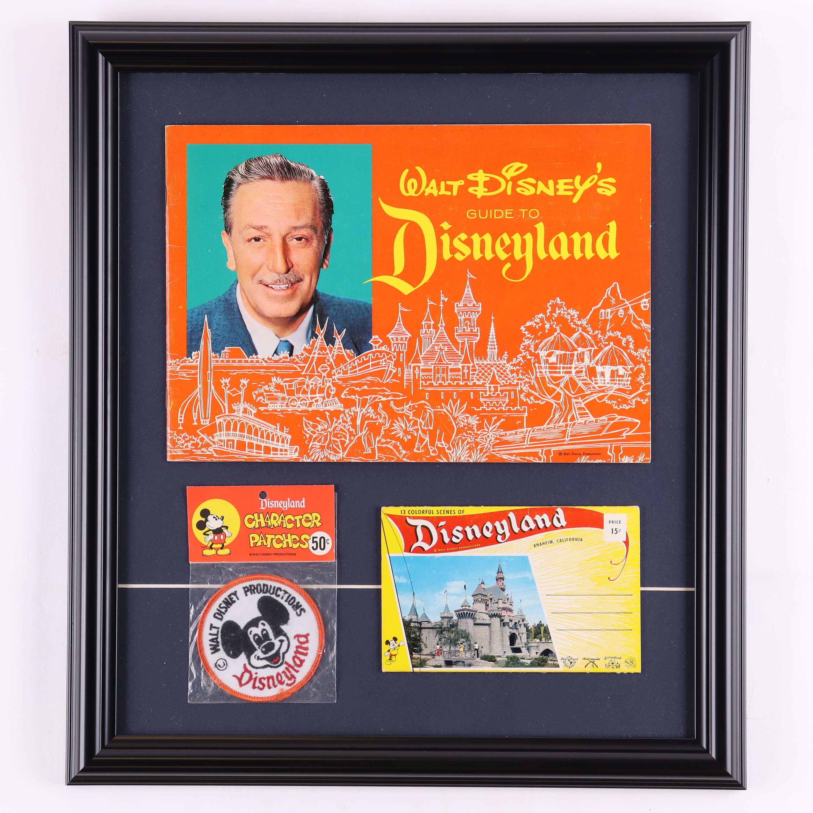 Disneyland Souvenir Vintage 1962 Guide & Postcard Portfolio Custom Framed Display with Mickey Mouse Patch In Original Packaging at PristineAuction.com Disneyland Souvenir Vintage 1962 Guide & Postcard Portfolio Custom Framed Display with Mickey Mouse Patch In Original Packaging at PristineAuction.com