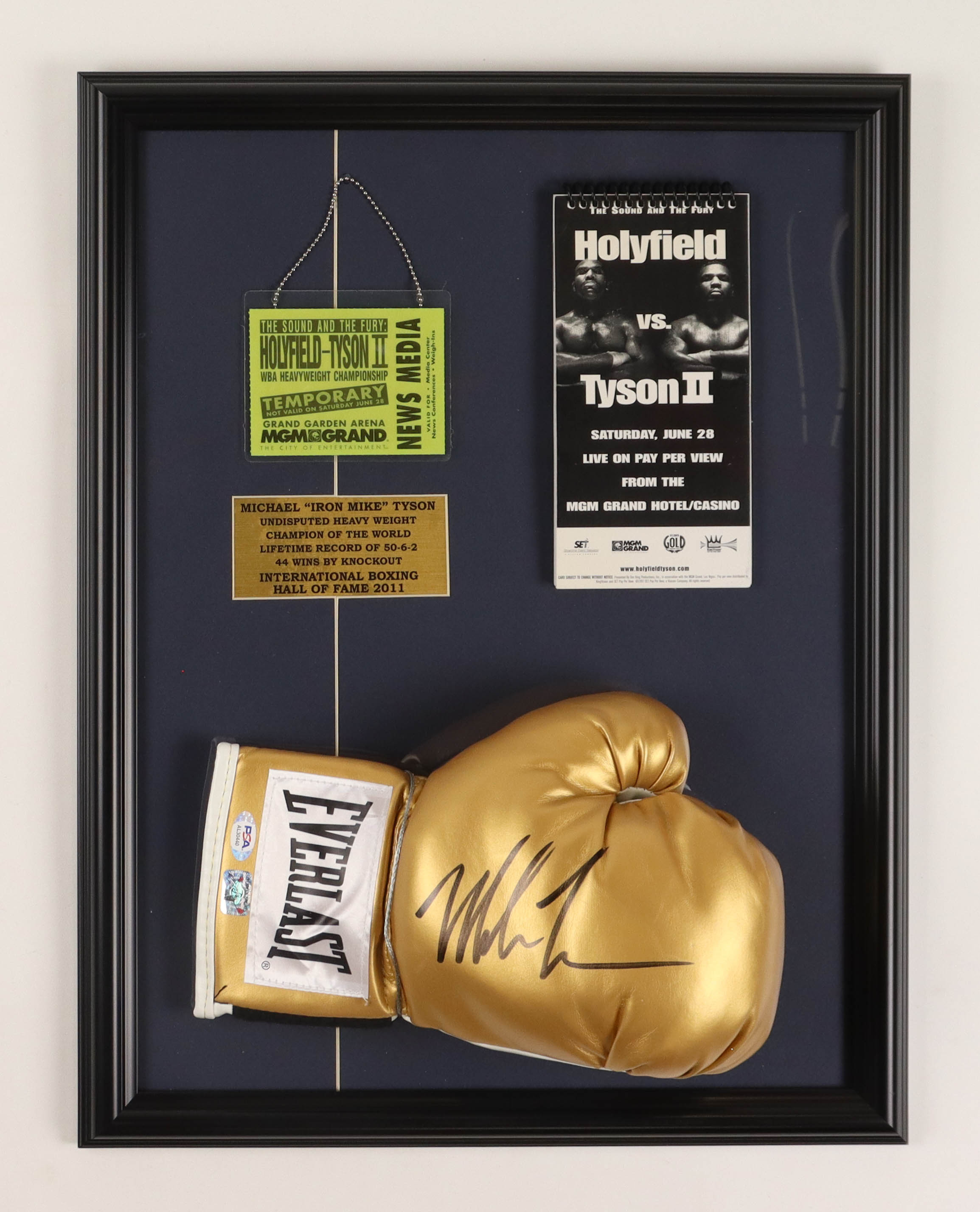Mike Tyson Signed Custom Framed Boxing Glove Display with Holyfield-Tyson 2 Fight Lanyard Press Credentials & Promo Notepad (PSA & Tyson) at PristineAuction.com Mike Tyson Signed Custom Framed Boxing Glove Display with Holyfield-Tyson 2 Fight Lanyard Press Credentials & Promo Notepad (PSA & Tyson) at PristineAuction.com
