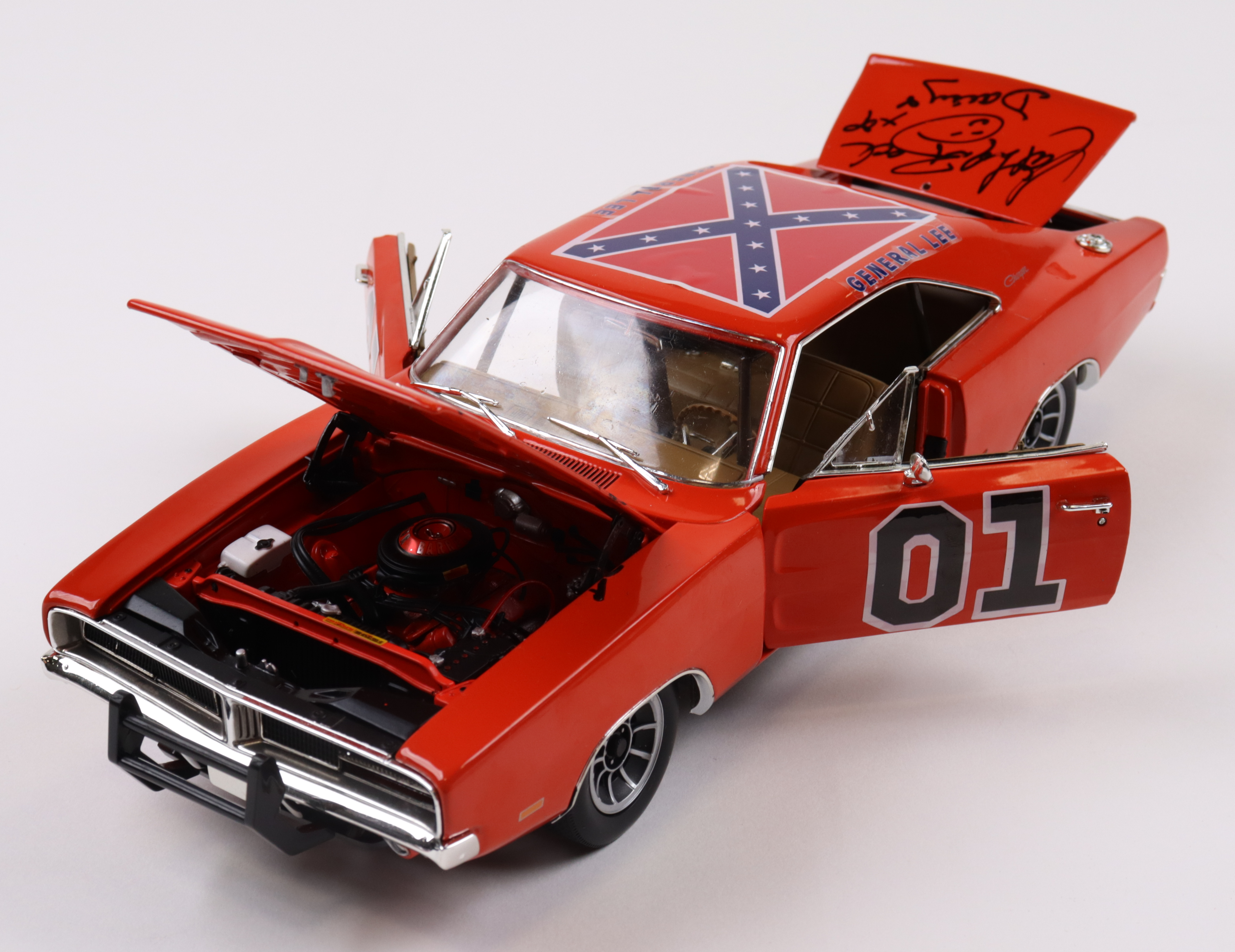 Catherine Bach, Tom Wopat & John Schneider Signed "The Dukes Of Hazzard" General Lee #01 1969 Dodge Charger 1:18 Premium Diecast Car with Multiple Inscriptions (JSA) at PristineAuction.com Catherine Bach, Tom Wopat & John Schneider Signed "The Dukes Of Hazzard" General Lee #01 1969 Dodge Charger 1:18 Premium Diecast Car with Multiple Inscriptions (JSA) at PristineAuction.com