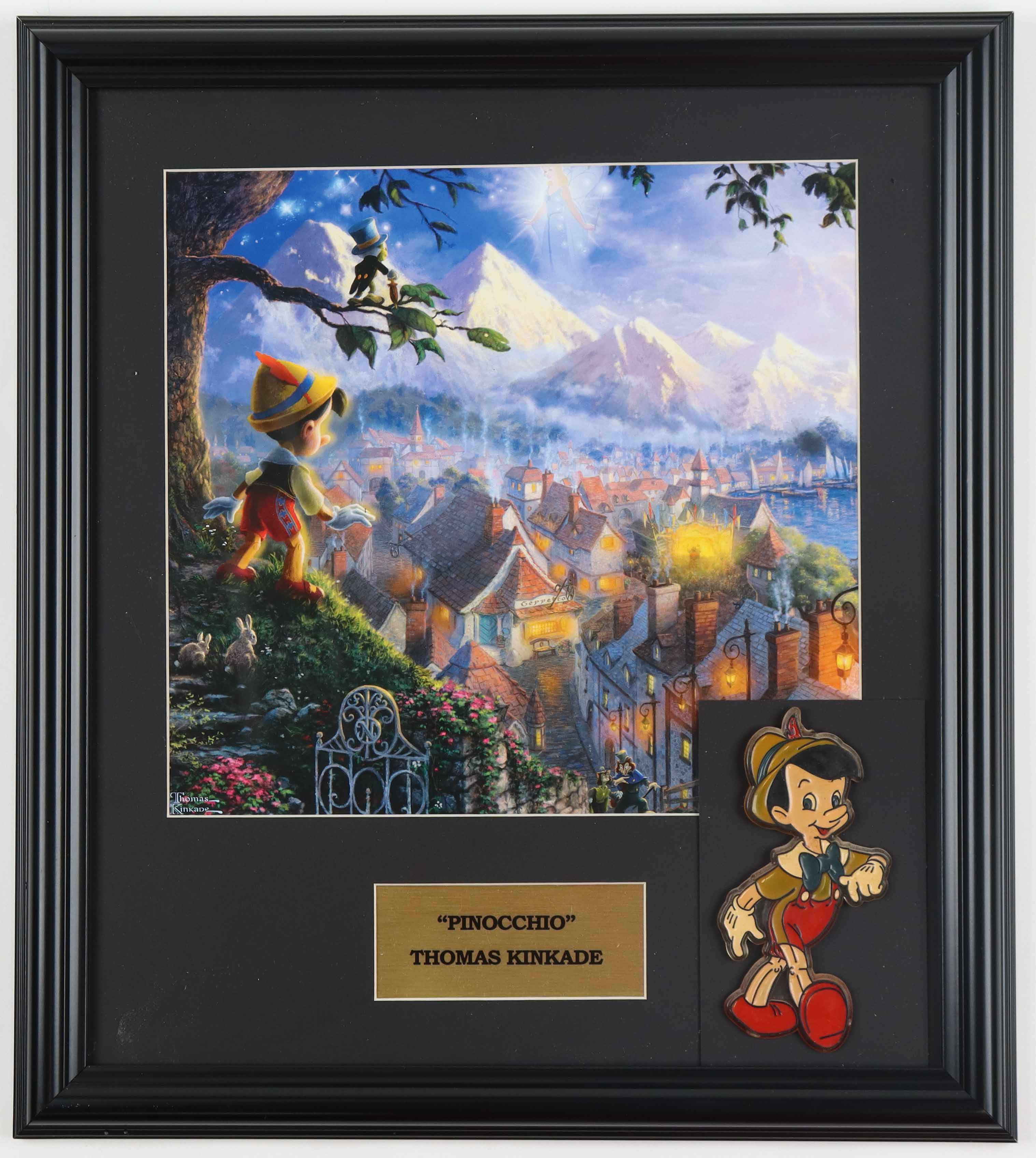 Thomas Kinkade Walt Disney's "Pinocchio" Custom Framed Print Display with Pinocchio Emblem at PristineAuction.com Thomas Kinkade Walt Disney's "Pinocchio" Custom Framed Print Display with Pinocchio Emblem at PristineAuction.com