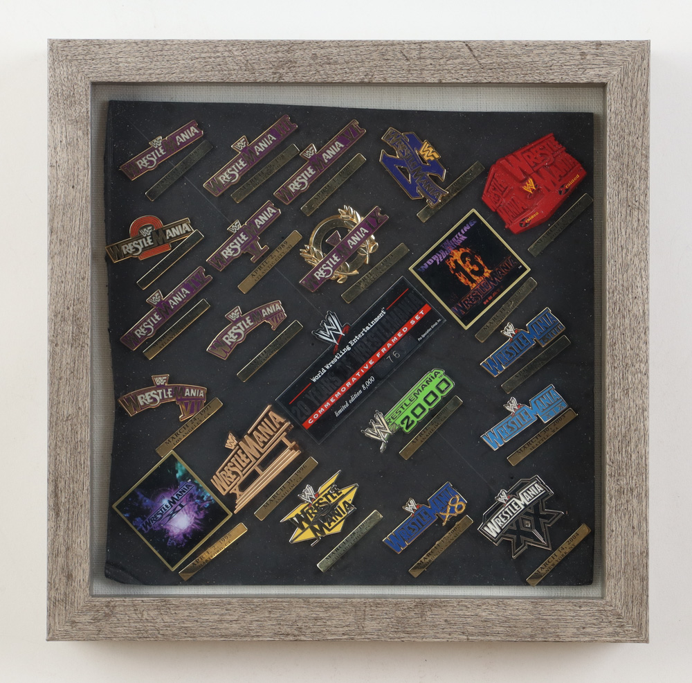 WWE LE Wrestlemania Custom Framed Pin Set with (21) Pins at PristineAuction.com WWE LE Wrestlemania Custom Framed Pin Set with (21) Pins at PristineAuction.com