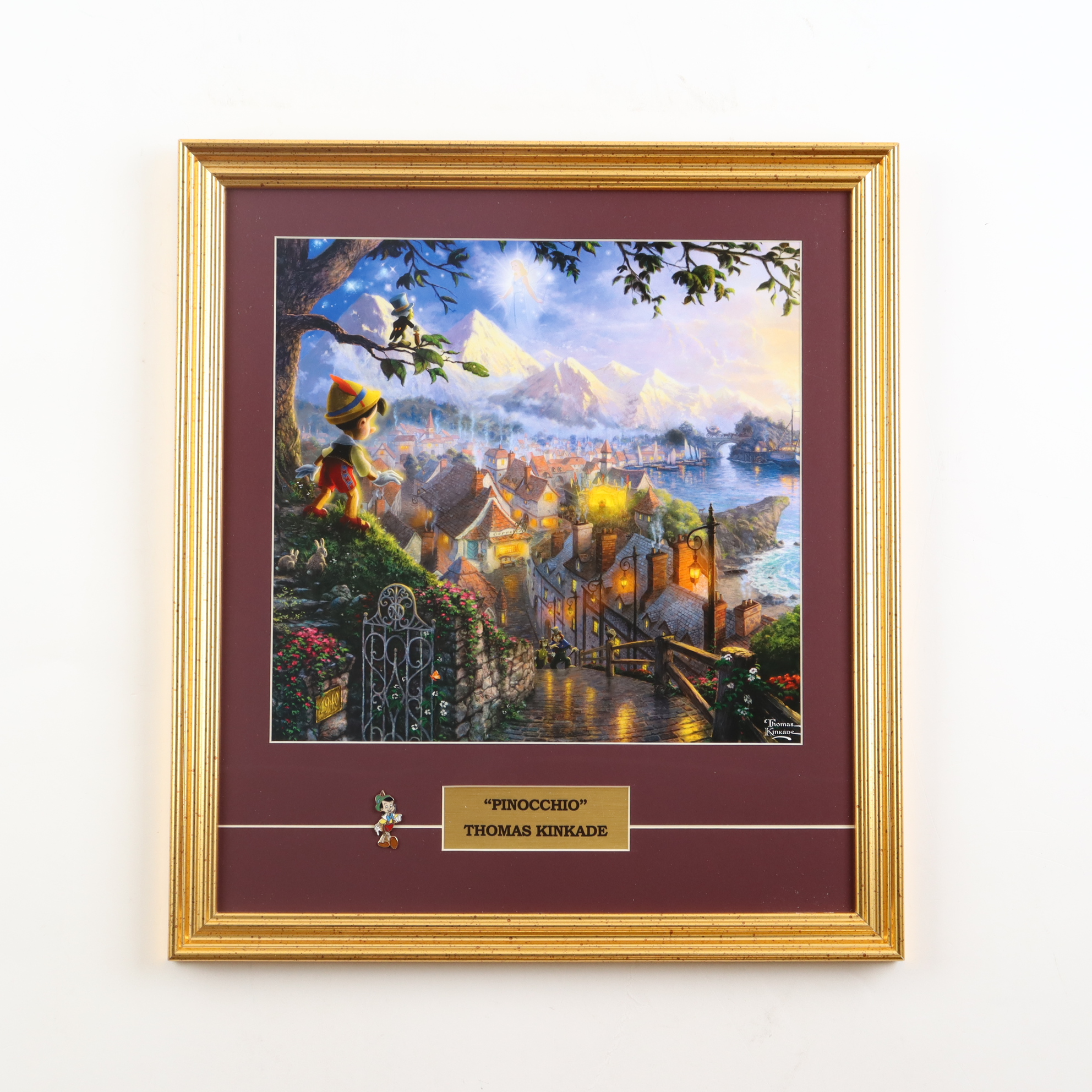 Thomas Kinkade Walt Disney's "Pinocchio" Custom Framed Print Display with Pinocchio Pin at PristineAuction.com Thomas Kinkade Walt Disney's "Pinocchio" Custom Framed Print Display with Pinocchio Pin at PristineAuction.com