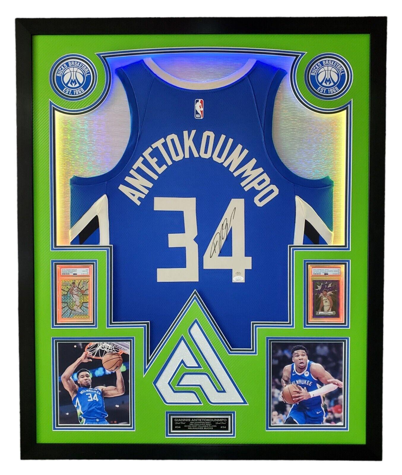 Giannis Antetokounmpo Signed 42x33 Custom Framed "The City" Jersey LED Backlit Display (JSA & Antetokounmpo) at PristineAuction.com Giannis Antetokounmpo Signed 42x33 Custom Framed "The City" Jersey LED Backlit Display (JSA & Antetokounmpo) at PristineAuction.com