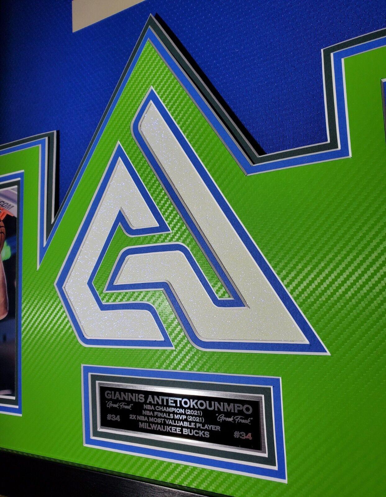 Giannis Antetokounmpo Signed 42x33 Custom Framed "The City" Jersey LED Backlit Display (JSA & Antetokounmpo) at PristineAuction.com Giannis Antetokounmpo Signed 42x33 Custom Framed "The City" Jersey LED Backlit Display (JSA & Antetokounmpo) at PristineAuction.com