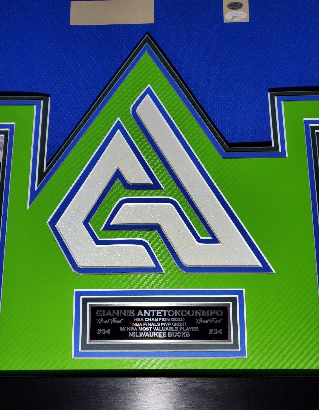 Giannis Antetokounmpo Signed 42x33 Custom Framed "The City" Jersey LED Backlit Display (JSA & Antetokounmpo) at PristineAuction.com Giannis Antetokounmpo Signed 42x33 Custom Framed "The City" Jersey LED Backlit Display (JSA & Antetokounmpo) at PristineAuction.com