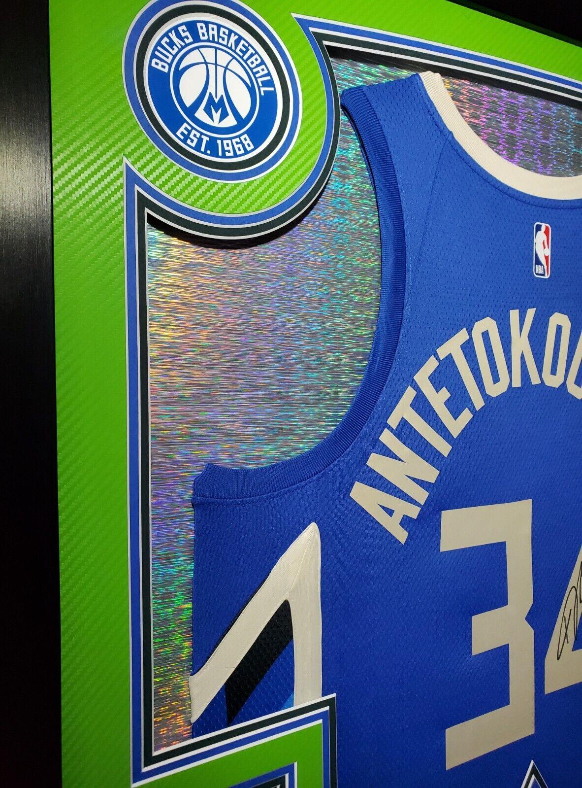 Giannis Antetokounmpo Signed 42x33 Custom Framed "The City" Jersey LED Backlit Display (JSA & Antetokounmpo) at PristineAuction.com Giannis Antetokounmpo Signed 42x33 Custom Framed "The City" Jersey LED Backlit Display (JSA & Antetokounmpo) at PristineAuction.com