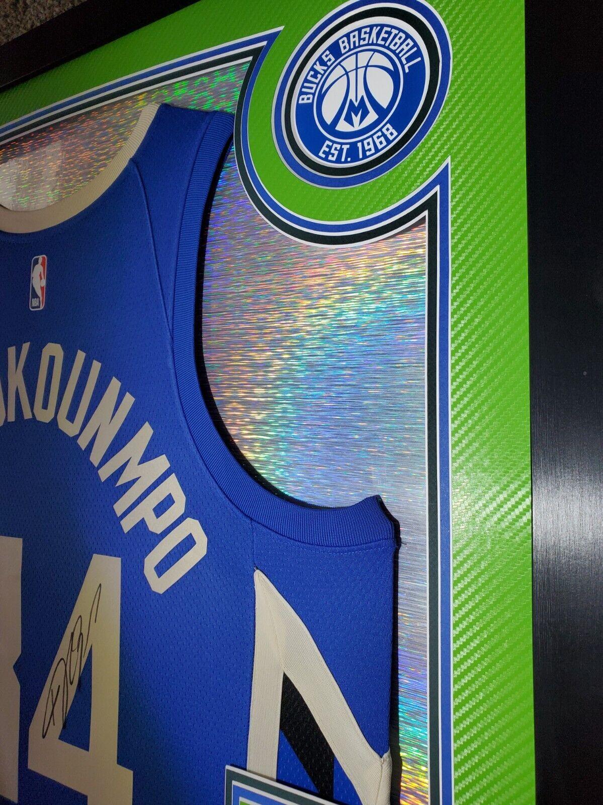 Giannis Antetokounmpo Signed 42x33 Custom Framed "The City" Jersey LED Backlit Display (JSA & Antetokounmpo) at PristineAuction.com Giannis Antetokounmpo Signed 42x33 Custom Framed "The City" Jersey LED Backlit Display (JSA & Antetokounmpo) at PristineAuction.com