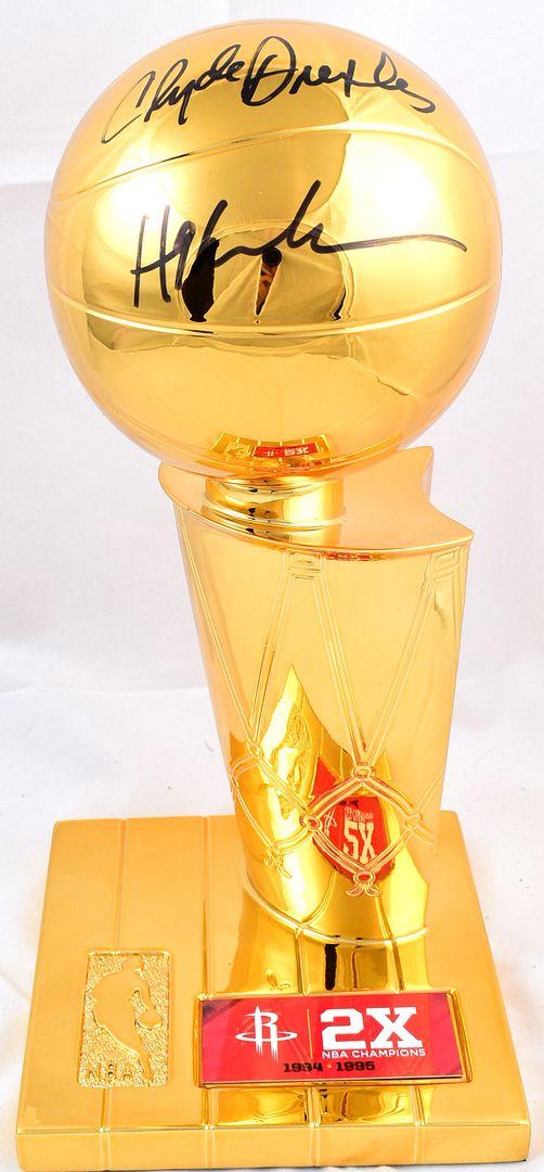 Hakeem Olajuwon & Clyde Drexler Signed Rockets 2x NBA Champions Replica Trophy (Beckett) at PristineAuction.com Hakeem Olajuwon & Clyde Drexler Signed Rockets 2x NBA Champions Replica Trophy (Beckett) at PristineAuction.com