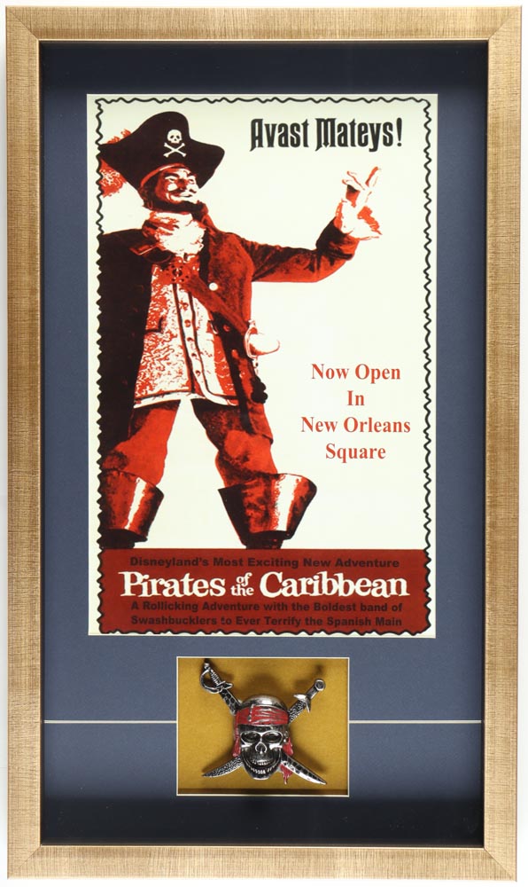 Disneyland "Pirates of the Caribbean" Custom Framed Poster Print Display with Metal Emblem at PristineAuction.com Disneyland "Pirates of the Caribbean" Custom Framed Poster Print Display with Metal Emblem at PristineAuction.com