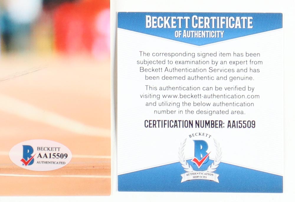 Usain Bolt Signed Team Jamaica 8x10 Photo (Beckett) at PristineAuction.com Usain Bolt Signed Team Jamaica 8x10 Photo (Beckett) at PristineAuction.com