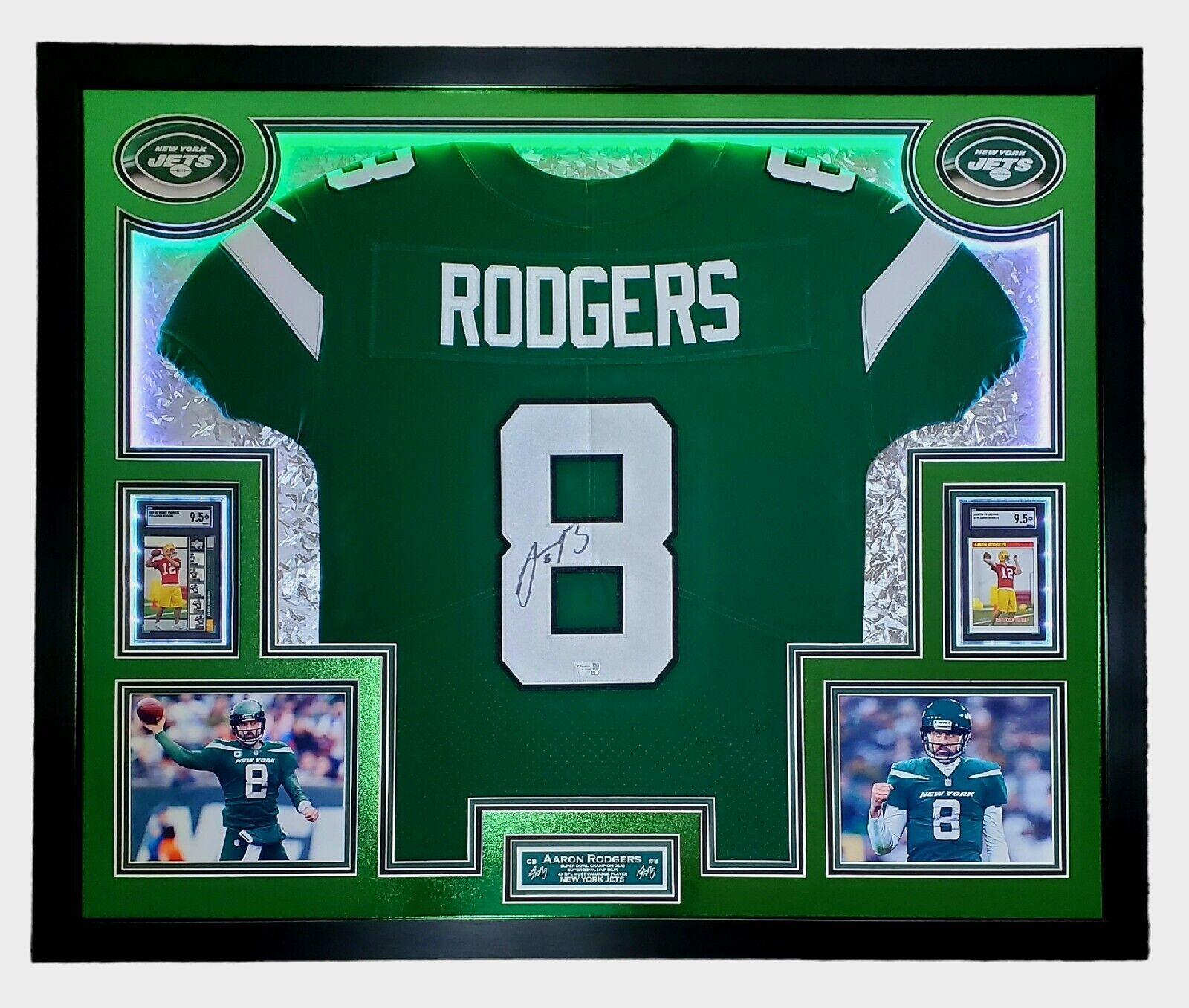 Aaron Rodgers Signed 33x42 Custom Framed Jersey Display with LED Lighting, 2005 UD Rookie Premiere #16 (RC) (SGC9.5)& 2005 Topps Bazooka #190 (RC) (SGC9.5) (Fanatics) at PristineAuction.com Aaron Rodgers Signed 33x42 Custom Framed Jersey Display with LED Lighting, 2005 UD Rookie Premiere #16 (RC) (SGC9.5)& 2005 Topps Bazooka #190 (RC) (SGC9.5) (Fanatics) at PristineAuction.com