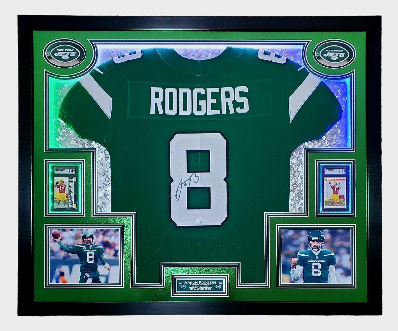 Aaron Rodgers Signed 33x42 Custom Framed Jersey Display with LED Lighting, 2005 UD Rookie Premiere #16 (RC) (SGC9.5)& 2005 Topps Bazooka #190 (RC) (SGC9.5) (Fanatics) at PristineAuction.com Aaron Rodgers Signed 33x42 Custom Framed Jersey Display with LED Lighting, 2005 UD Rookie Premiere #16 (RC) (SGC9.5)& 2005 Topps Bazooka #190 (RC) (SGC9.5) (Fanatics) at PristineAuction.com