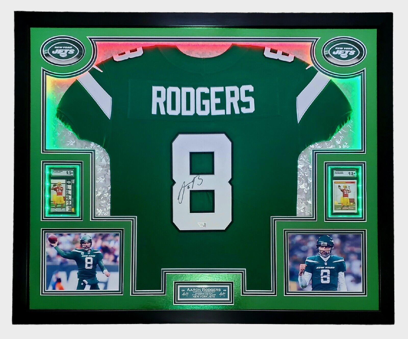 Aaron Rodgers Signed 33x42 Custom Framed Jersey Display with LED Lighting, 2005 UD Rookie Premiere #16 (RC) (SGC9.5)& 2005 Topps Bazooka #190 (RC) (SGC9.5) (Fanatics) at PristineAuction.com Aaron Rodgers Signed 33x42 Custom Framed Jersey Display with LED Lighting, 2005 UD Rookie Premiere #16 (RC) (SGC9.5)& 2005 Topps Bazooka #190 (RC) (SGC9.5) (Fanatics) at PristineAuction.com