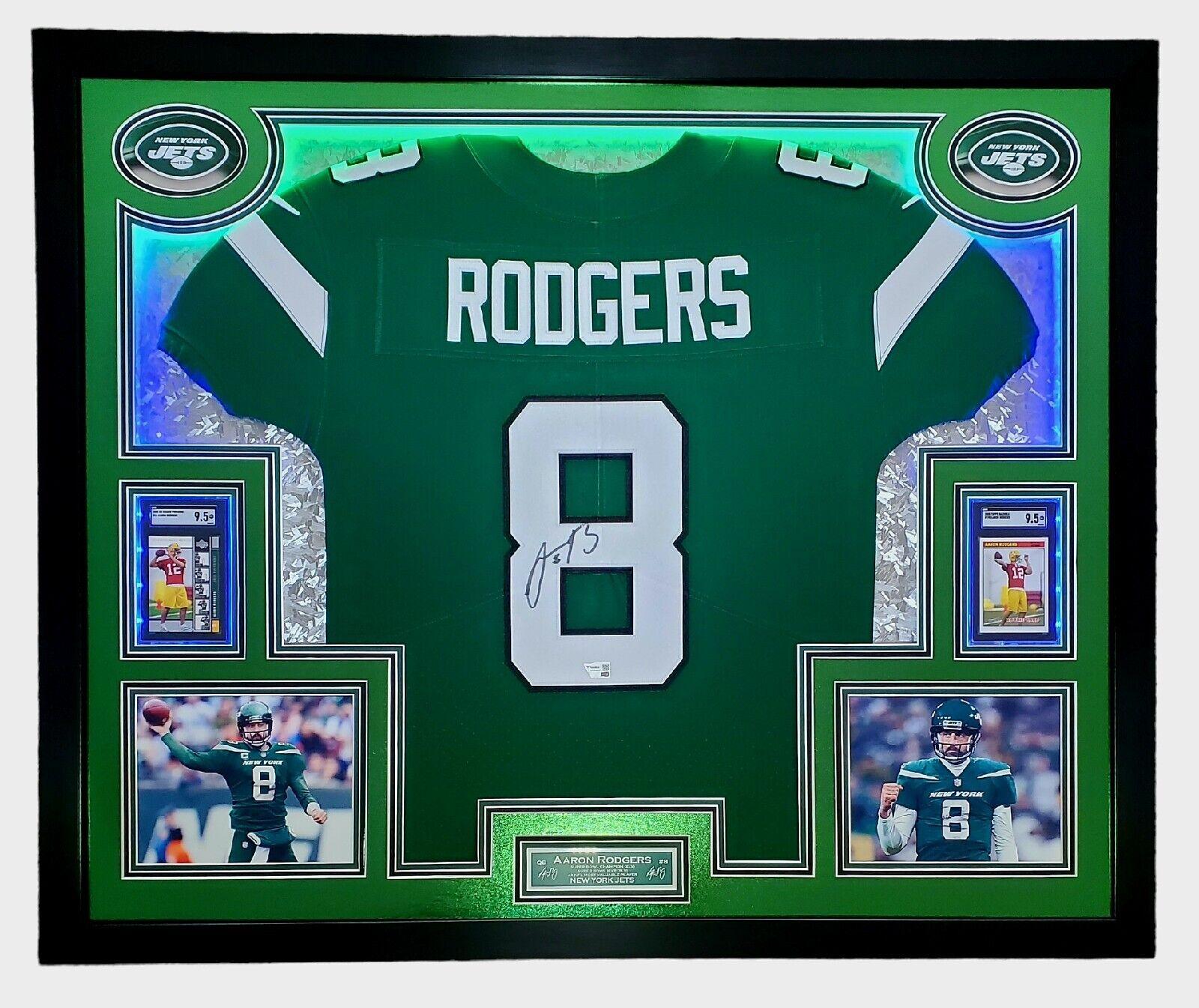 Aaron Rodgers Signed 33x42 Custom Framed Jersey Display with LED Lighting, 2005 UD Rookie Premiere #16 (RC) (SGC9.5)& 2005 Topps Bazooka #190 (RC) (SGC9.5) (Fanatics) at PristineAuction.com Aaron Rodgers Signed 33x42 Custom Framed Jersey Display with LED Lighting, 2005 UD Rookie Premiere #16 (RC) (SGC9.5)& 2005 Topps Bazooka #190 (RC) (SGC9.5) (Fanatics) at PristineAuction.com
