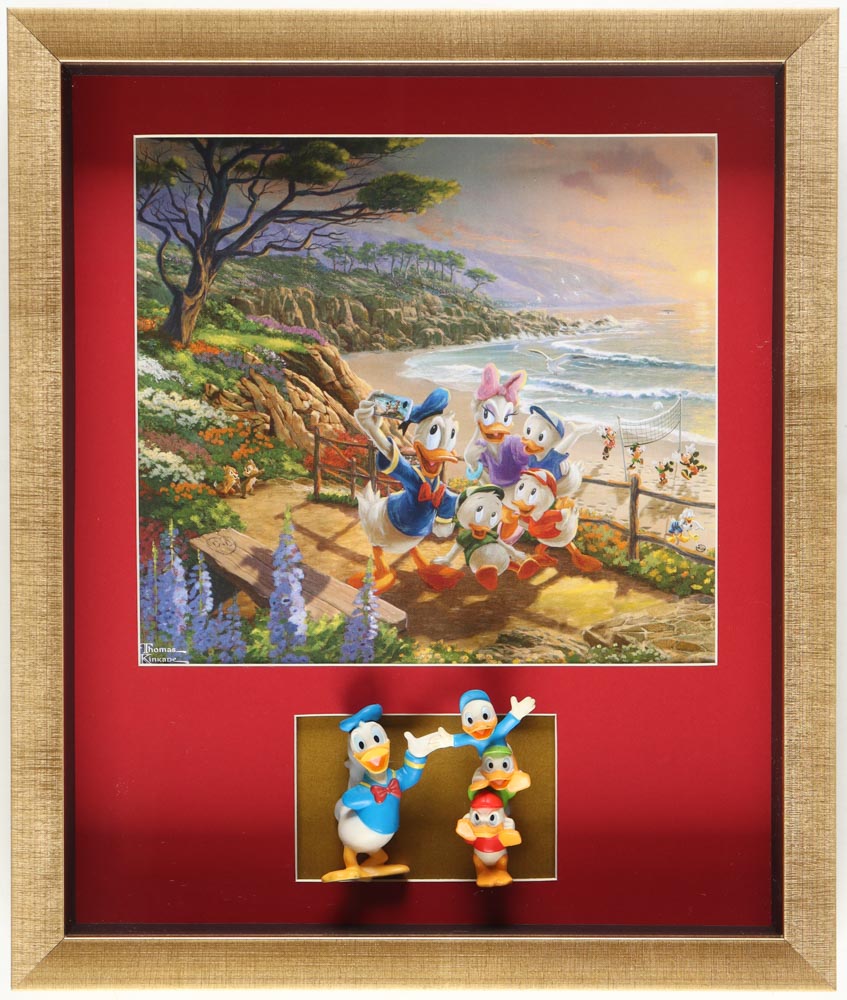 Thomas Kinkade "Donald Duck & Daisy" Custom Framed Print Display with Set of (2) Figurines at PristineAuction.com Thomas Kinkade "Donald Duck & Daisy" Custom Framed Print Display with Set of (2) Figurines at PristineAuction.com
