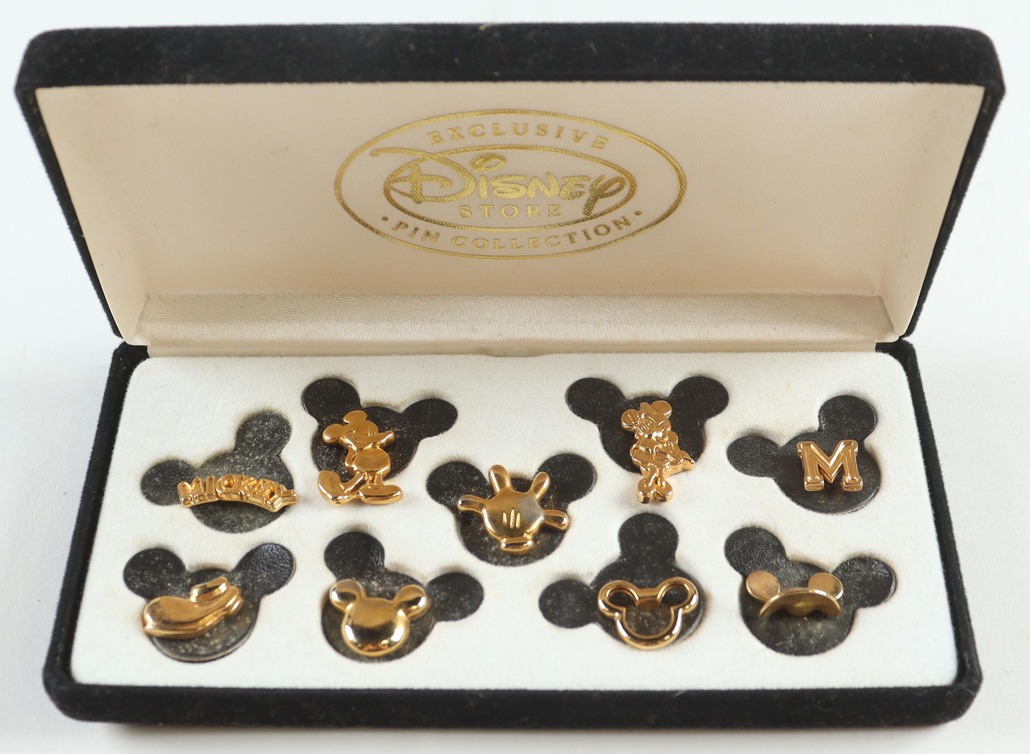 Disney Mickey Mouse Felt Boxed Vintage Set of (9) Gold Pins at PristineAuction.com Disney Mickey Mouse Felt Boxed Vintage Set of (9) Gold Pins at PristineAuction.com