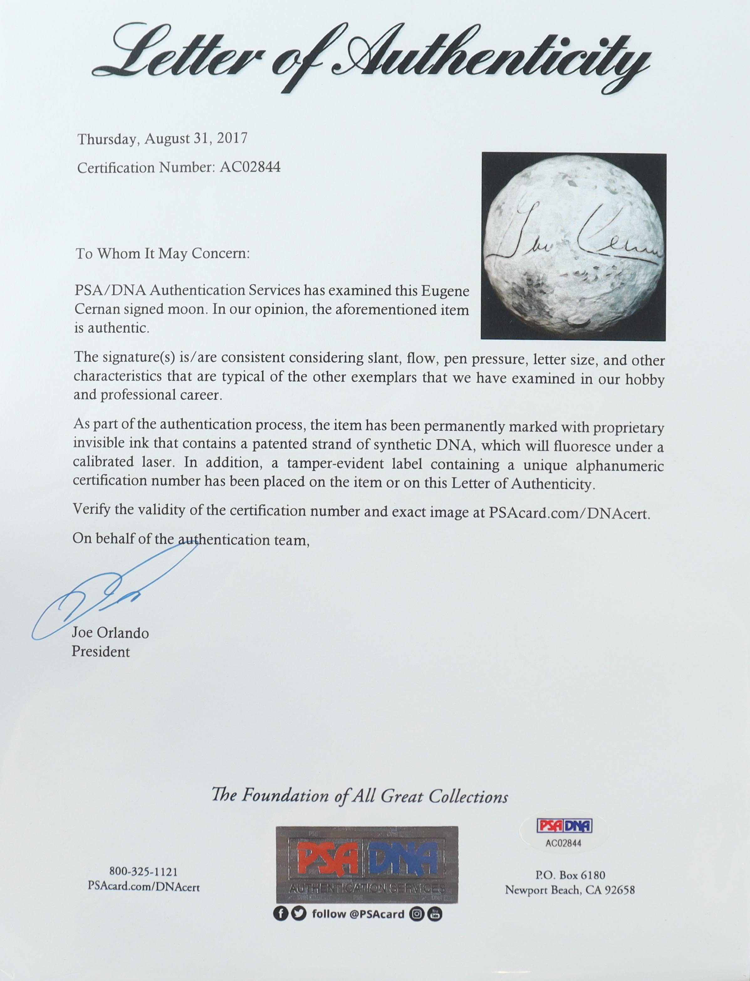 Eugene Cernan Signed Replica Moon with Display Case (PSA) at PristineAuction.com Eugene Cernan Signed Replica Moon with Display Case (PSA) at PristineAuction.com