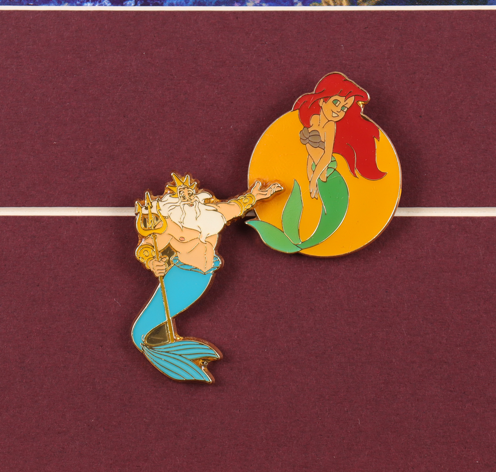 Thomas Kinkade "The Little Mermaid" Custom Framed Print Display with Set of (2) Official Movie Pins at PristineAuction.com Thomas Kinkade "The Little Mermaid" Custom Framed Print Display with Set of (2) Official Movie Pins at PristineAuction.com