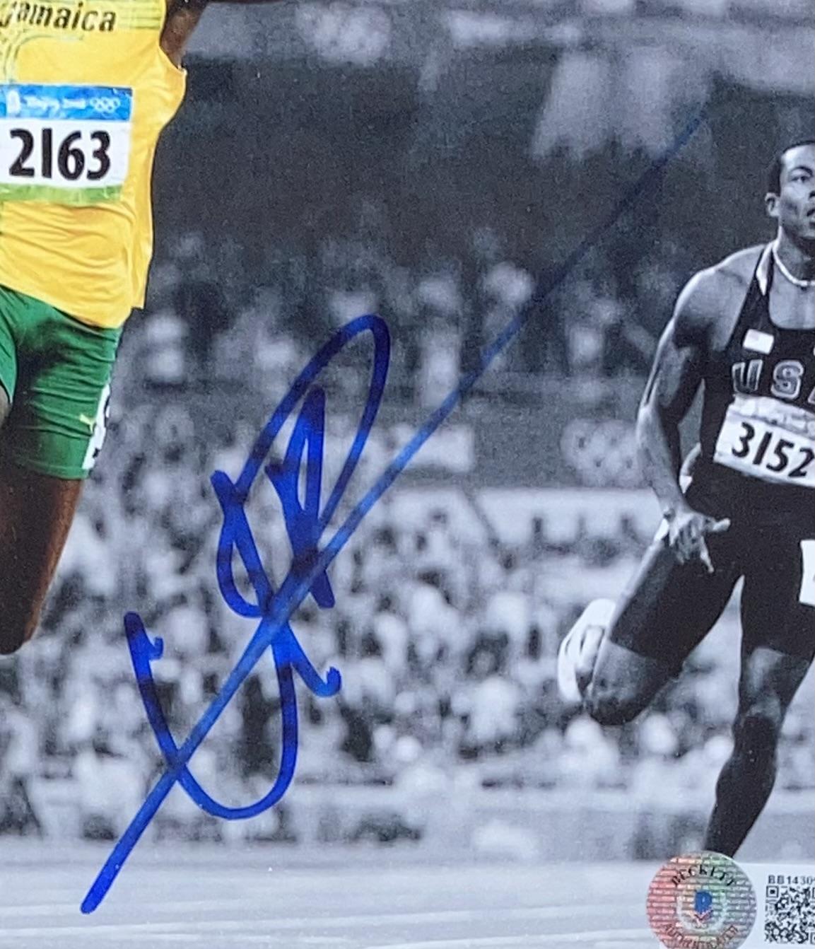Usain Bolt Signed Team Jamaica Custom Framed Photo Display (Beckett) at PristineAuction.com Usain Bolt Signed Team Jamaica Custom Framed Photo Display (Beckett) at PristineAuction.com