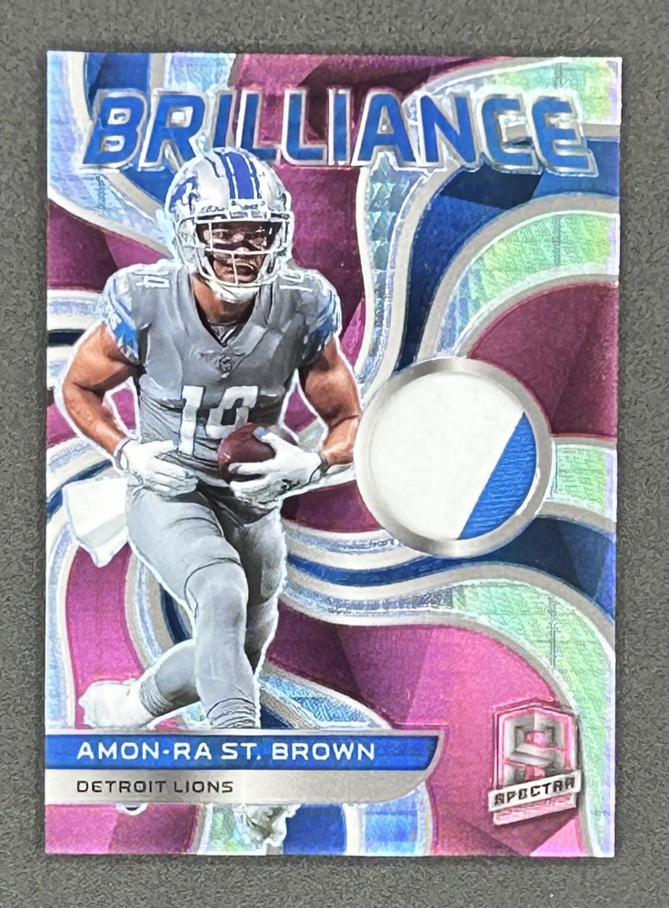 Amon-Ra St. Brown 2022 Panini Spectra Brilliance Materials Neon Pink #23 #10/15 at PristineAuction.com Amon-Ra St. Brown 2022 Panini Spectra Brilliance Materials Neon Pink #23 #10/15 at PristineAuction.com