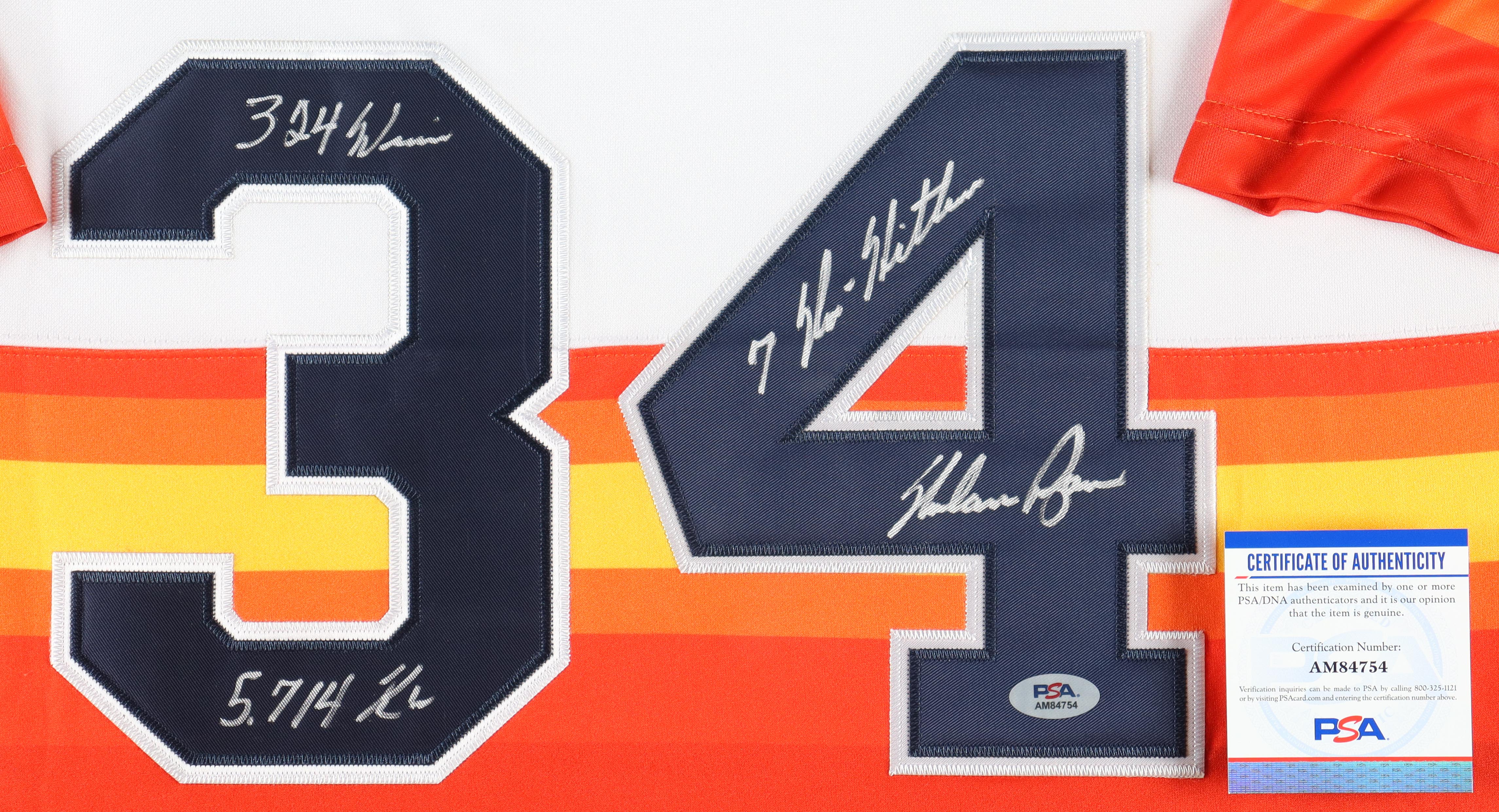 Nolan Ryan Signed Custom Framed Jersey Display With 1999 Hall Of Fame Induction Pin & (2) Metal Logo Embelms Inscribed "324 Wins", "5,714 X's" & "7 No-Hitters" (PSA) at PristineAuction.com Nolan Ryan Signed Custom Framed Jersey Display With 1999 Hall Of Fame Induction Pin & (2) Metal Logo Embelms Inscribed "324 Wins", "5,714 X's" & "7 No-Hitters" (PSA) at PristineAuction.com