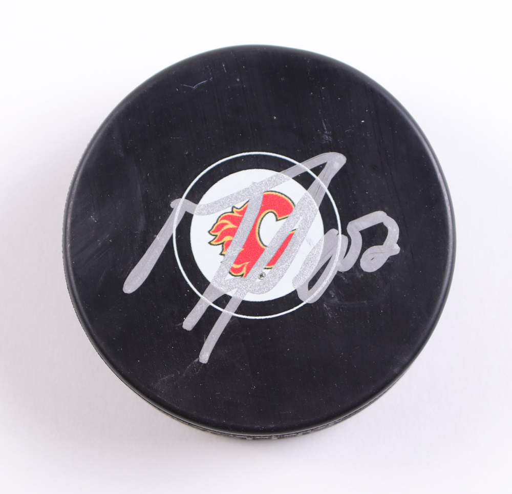 MacKenzie Weegar Signed Flames Logo Puck (Beckett) at PristineAuction.com MacKenzie Weegar Signed Flames Logo Puck (Beckett) at PristineAuction.com