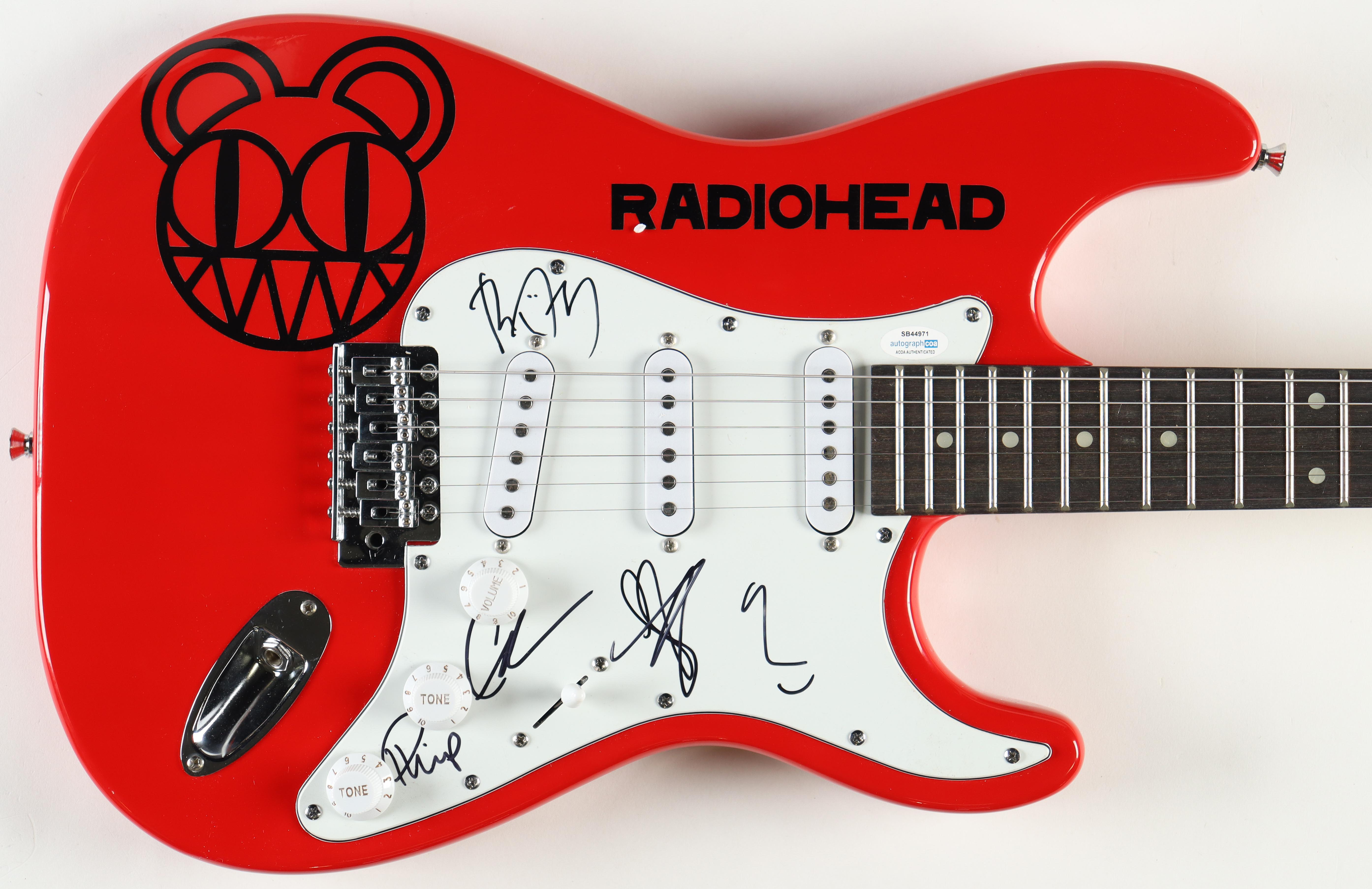 Radiohead Full-Size Electric Guitar Band-Signed By (5) With Thom Yorke, Jonny Greenwood, Colin Greenwood, Ed O'Brien (AutographCOA) at PristineAuction.com Radiohead Full-Size Electric Guitar Band-Signed By (5) With Thom Yorke, Jonny Greenwood, Colin Greenwood, Ed O'Brien (AutographCOA) at PristineAuction.com