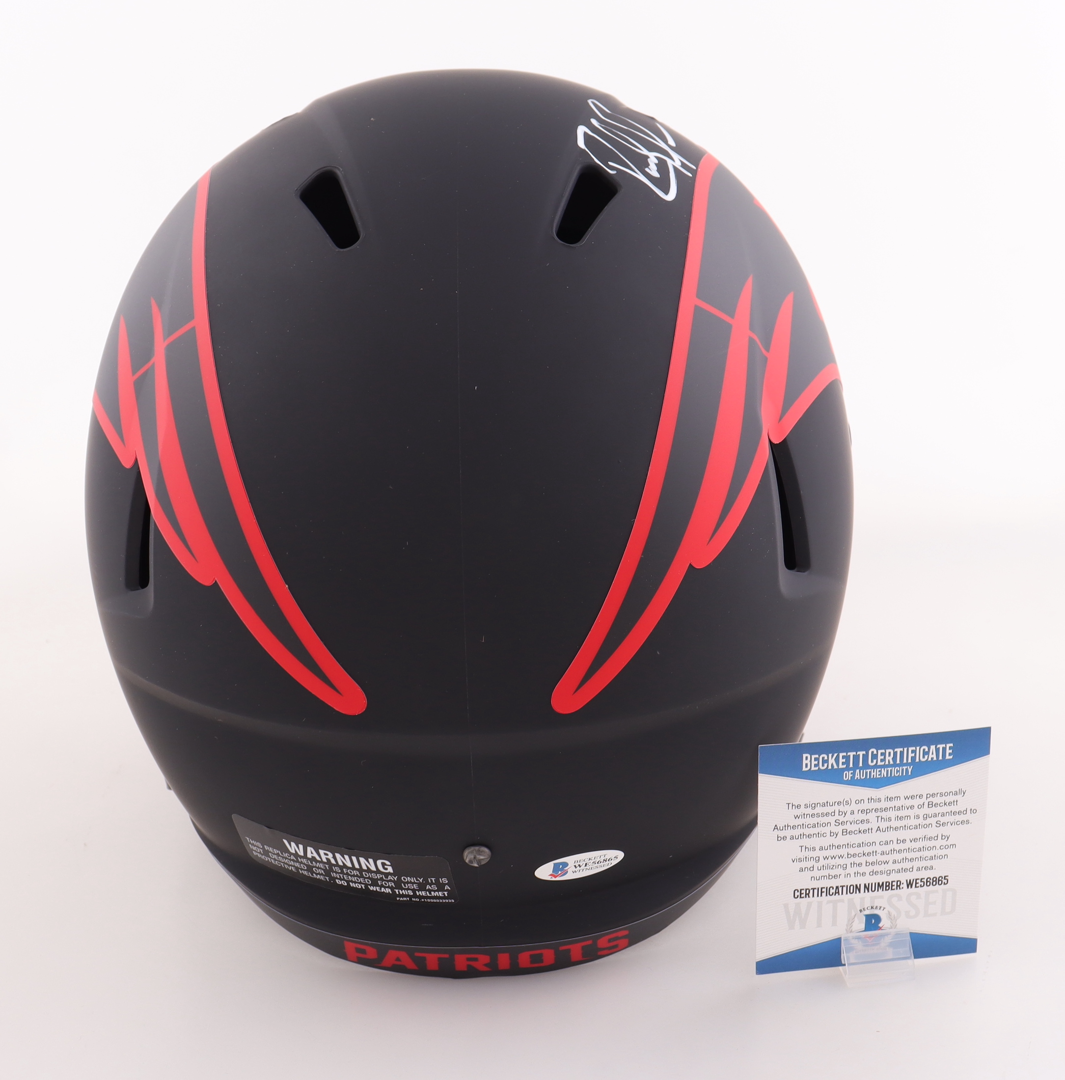 Randy Moss Signed Patriots Full Size Eclipse Alternate Speed Helmet Inscribed "Straight Cash Homie" (Beckett) at PristineAuction.com Randy Moss Signed Patriots Full Size Eclipse Alternate Speed Helmet Inscribed "Straight Cash Homie" (Beckett) at PristineAuction.com