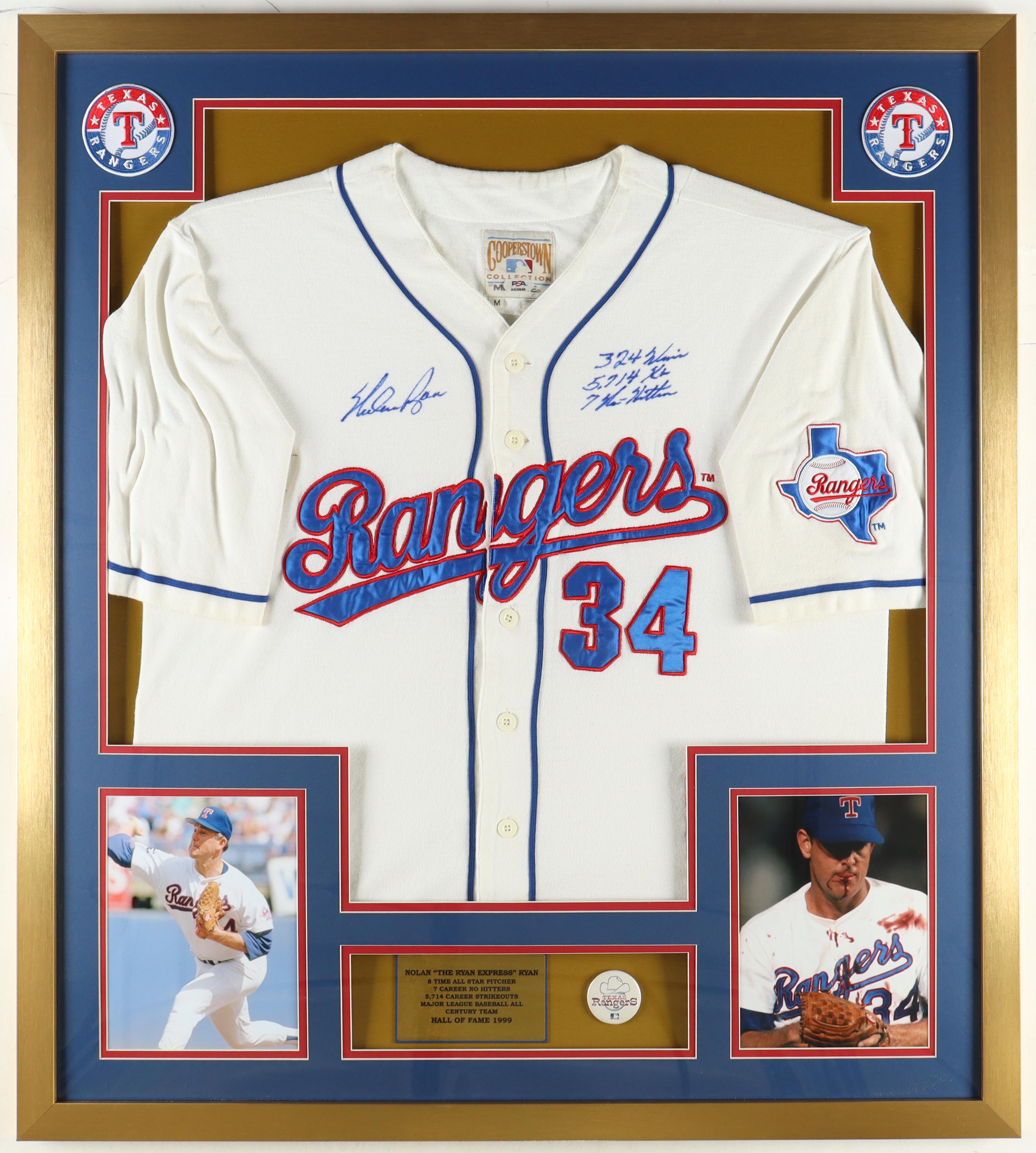 Nolan Ryan Signed Custom Framed Jersey Display Inscribed "324 Wins, 5714 K's & 7 No-Hitters" With Vintage Rangers Metal Pin (PSA) at PristineAuction.com Nolan Ryan Signed Custom Framed Jersey Display Inscribed "324 Wins, 5714 K's & 7 No-Hitters" With Vintage Rangers Metal Pin (PSA) at PristineAuction.com