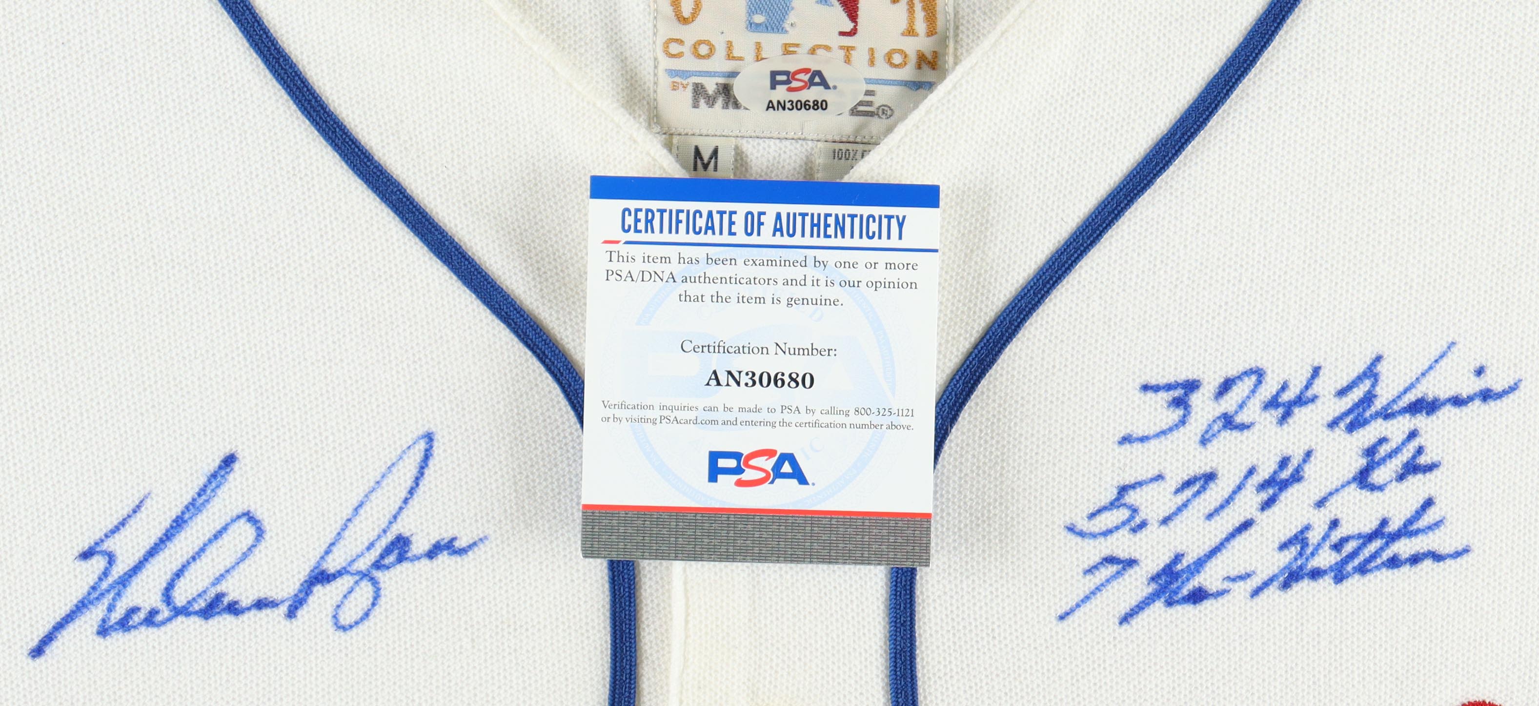 Nolan Ryan Signed Custom Framed Jersey Display Inscribed "324 Wins, 5714 K's & 7 No-Hitters" With Vintage Rangers Metal Pin (PSA) at PristineAuction.com Nolan Ryan Signed Custom Framed Jersey Display Inscribed "324 Wins, 5714 K's & 7 No-Hitters" With Vintage Rangers Metal Pin (PSA) at PristineAuction.com