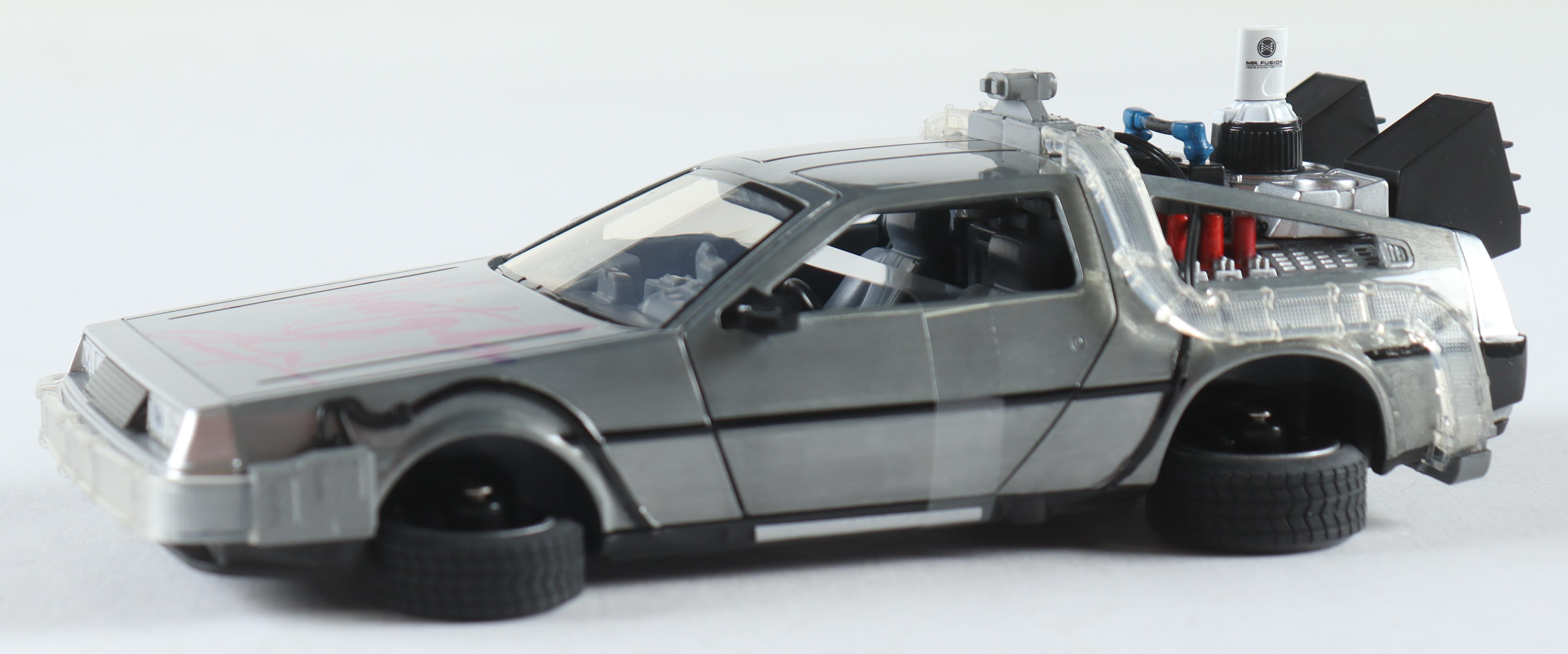 Christopher Lloyd Signed "Back to the Future II" DeLorean Time Machine 1:24 Scale Die-Cast Car With Original Packaging (Beckett) at PristineAuction.com Christopher Lloyd Signed "Back to the Future II" DeLorean Time Machine 1:24 Scale Die-Cast Car With Original Packaging (Beckett) at PristineAuction.com