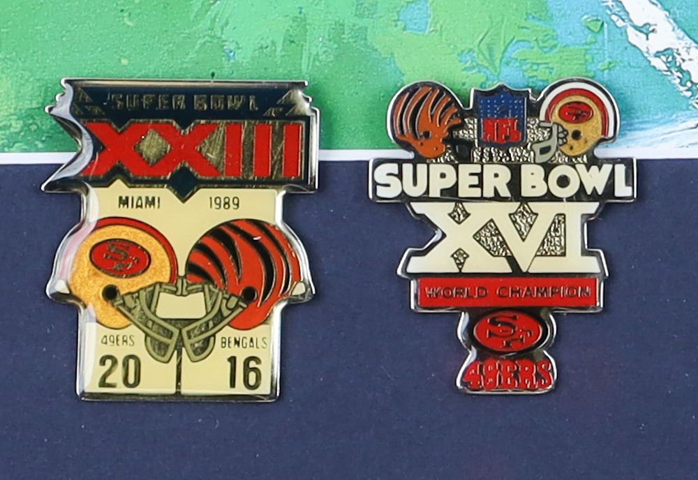 Leroy Neiman Custom Framed Joe Montana Print Display with (2) Super Bowl XIV and XXIII 49ers Pins at PristineAuction.com Leroy Neiman Custom Framed Joe Montana Print Display with (2) Super Bowl XIV and XXIII 49ers Pins at PristineAuction.com