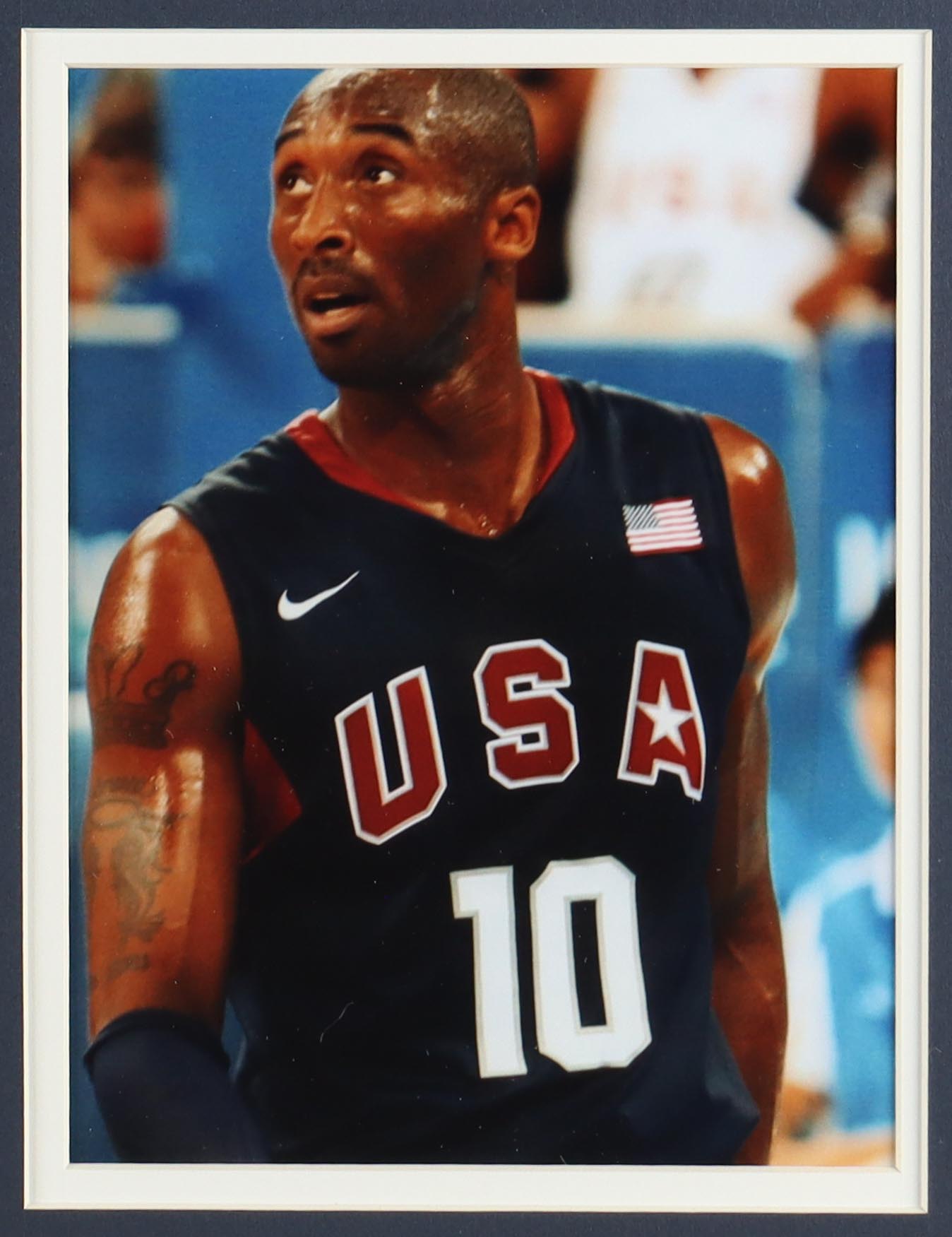 Kobe Bryant Team USA Custom Framed Nike Jersey Display with (2) Vintage USA Basketball Pins & (2) Cloth Patches at PristineAuction.com Kobe Bryant Team USA Custom Framed Nike Jersey Display with (2) Vintage USA Basketball Pins & (2) Cloth Patches at PristineAuction.com