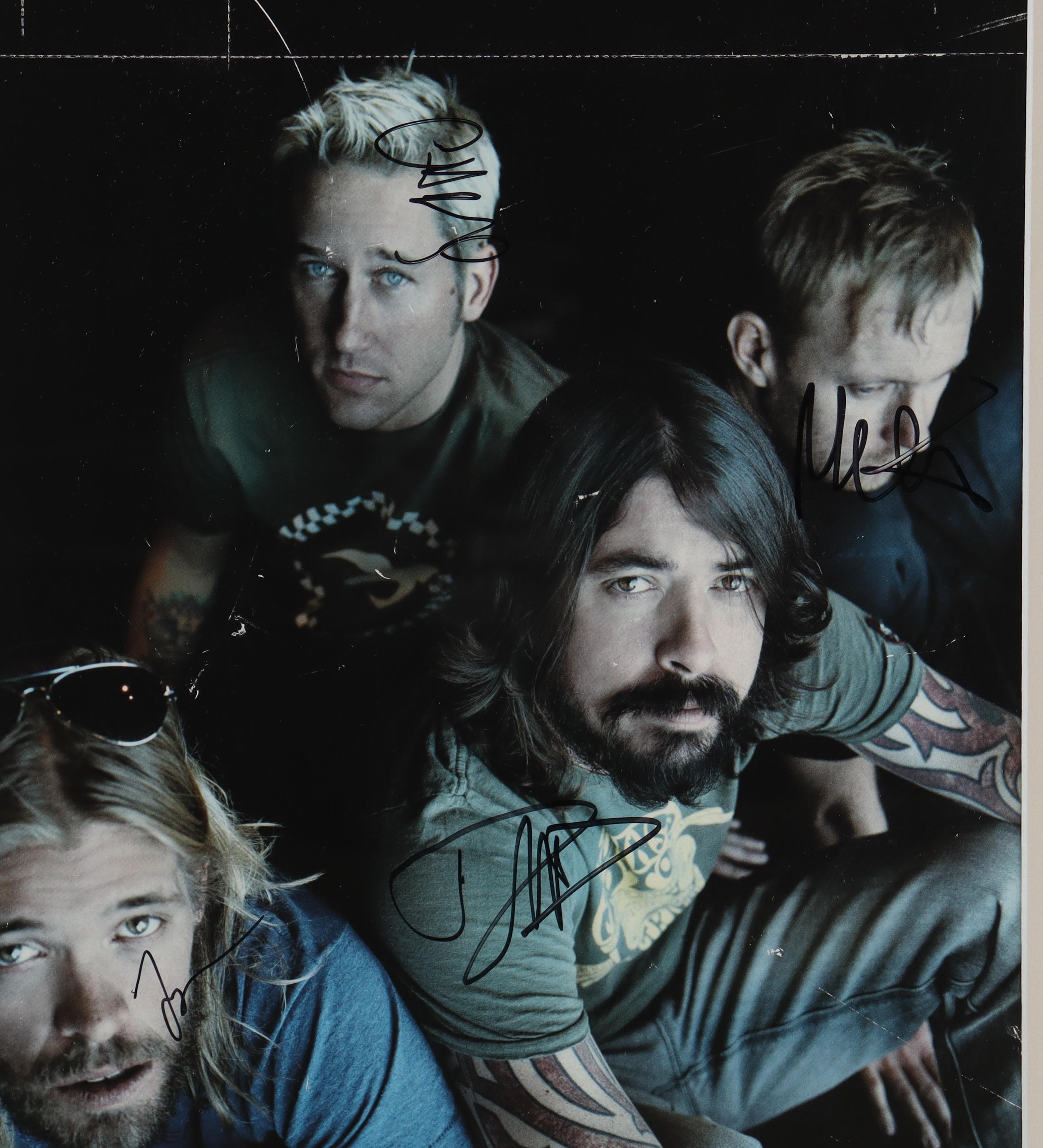 Foo Fighters Custom Framed Photo Display Band-Signed By (4) with Taylor Hawkins, Dave Grohl, Chris Shiflett, Nate Mendel (AutographCOA) at PristineAuction.com Foo Fighters Custom Framed Photo Display Band-Signed By (4) with Taylor Hawkins, Dave Grohl, Chris Shiflett, Nate Mendel (AutographCOA) at PristineAuction.com