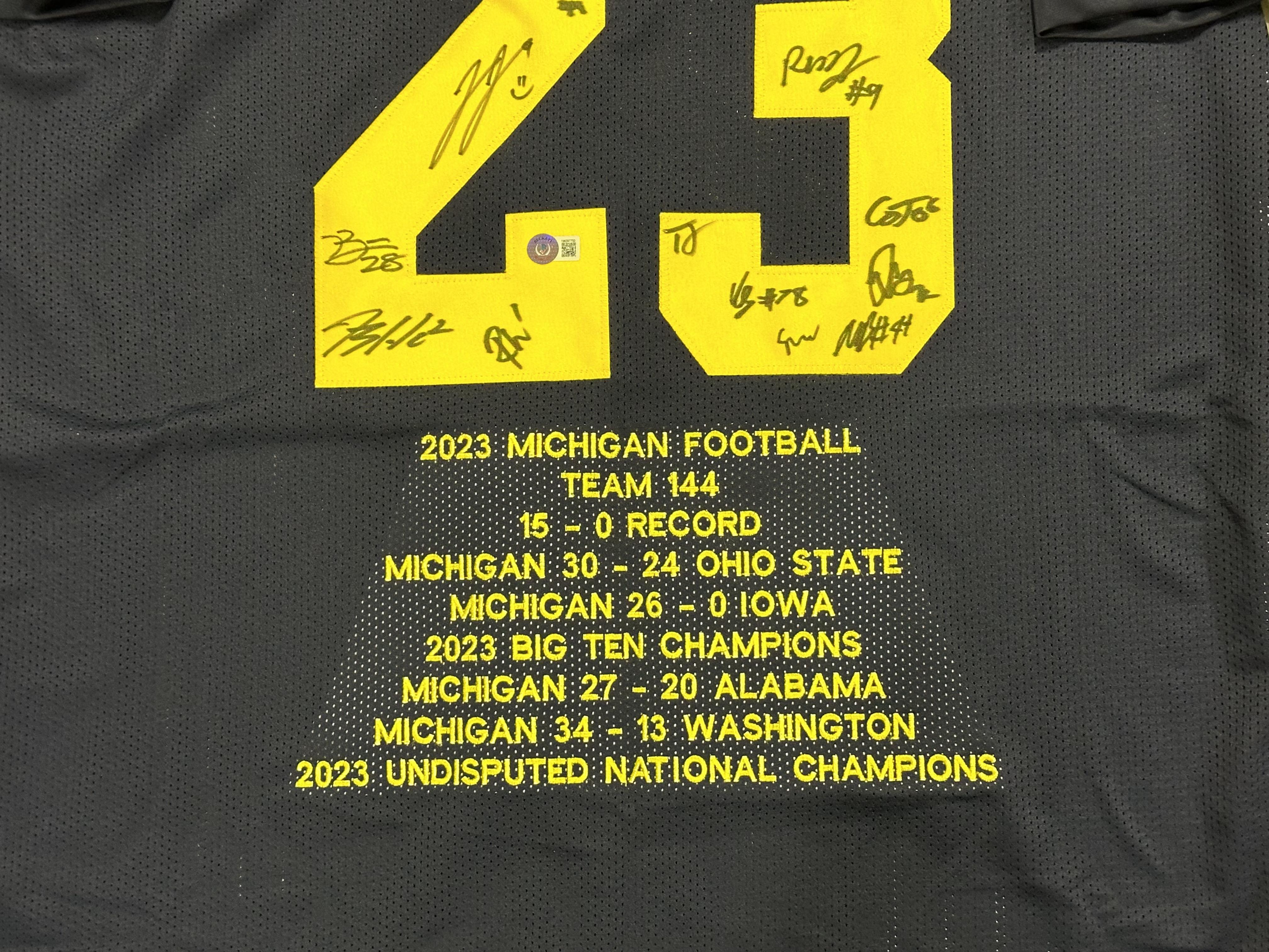2023 Michigan Wolverines Season Highlight Jersey Team-Signed by (18) with JJ McCarthy, Blake Corum, Roman Wilson (Beckett) at PristineAuction.com 2023 Michigan Wolverines Season Highlight Jersey Team-Signed by (18) with JJ McCarthy, Blake Corum, Roman Wilson (Beckett) at PristineAuction.com