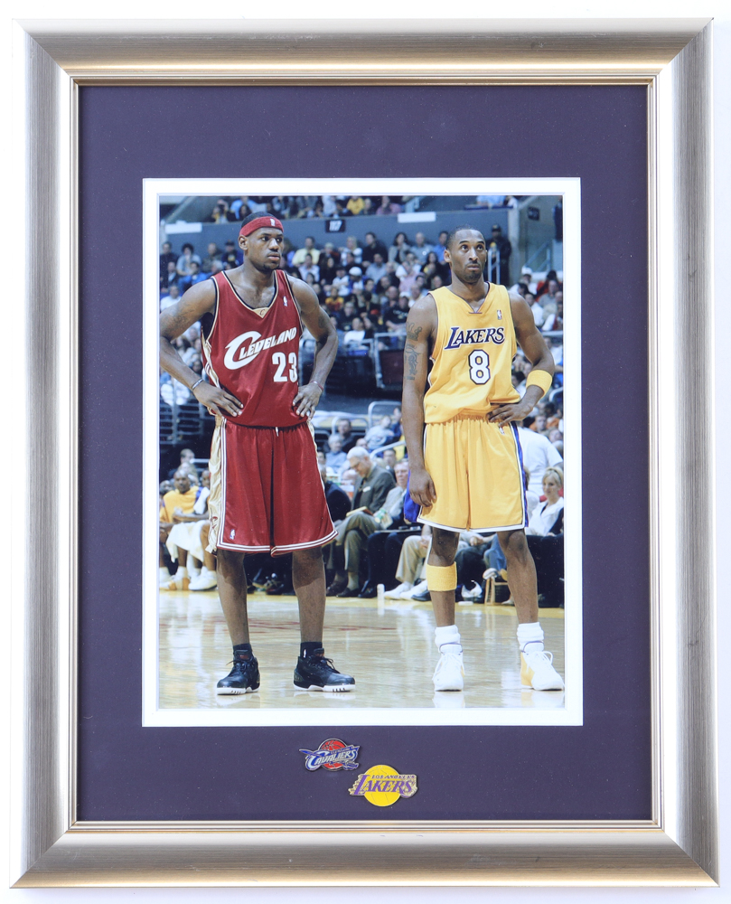 Kobe Bryant & LeBron James Custom Framed Photo Display with Official Cavaliers & Lakers Metal Logo Pins at PristineAuction.com Kobe Bryant & LeBron James Custom Framed Photo Display with Official Cavaliers & Lakers Metal Logo Pins at PristineAuction.com