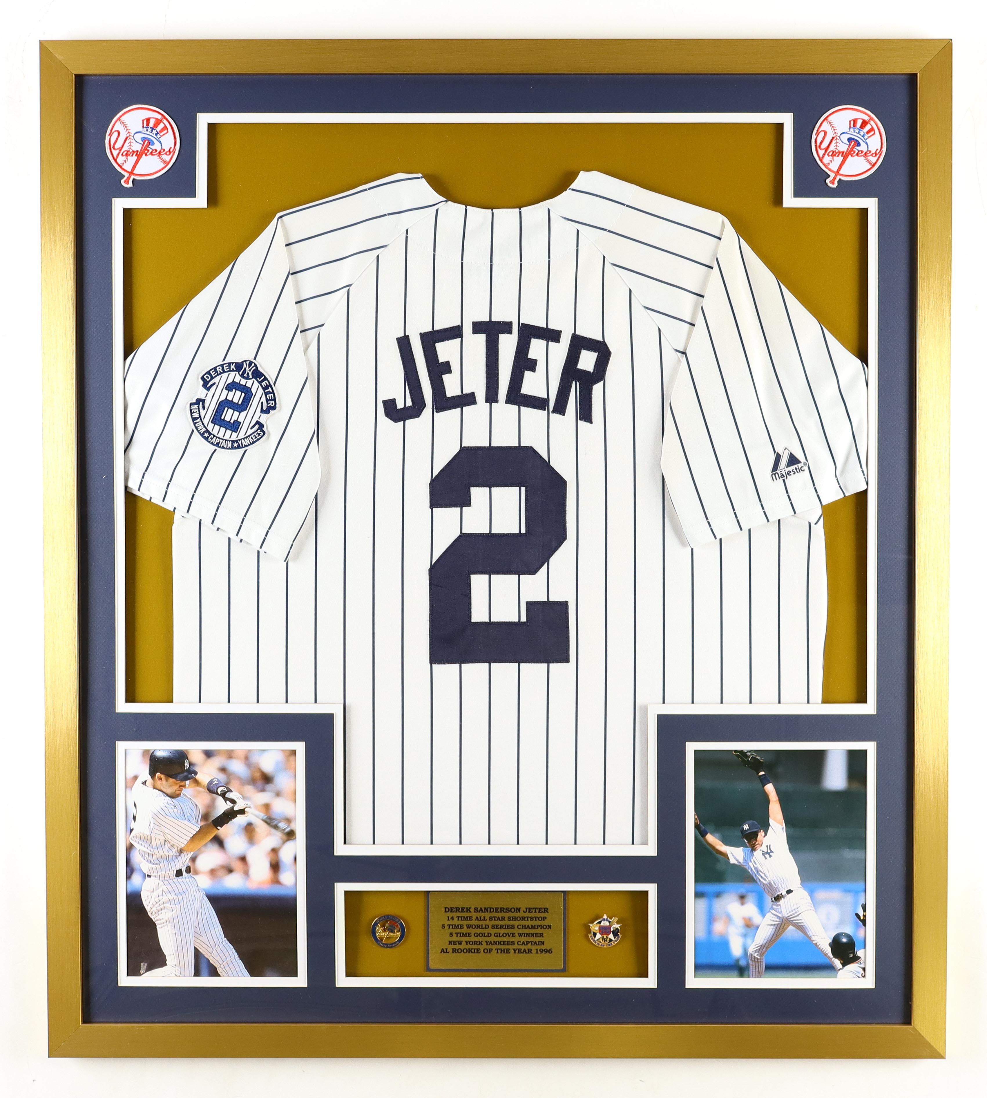 Derek Jeter Signed Yankees Custom Framed Majestic Jersey Display With Rookie Of The Year & LE World Series Pins at PristineAuction.com Derek Jeter Signed Yankees Custom Framed Majestic Jersey Display With Rookie Of The Year & LE World Series Pins at PristineAuction.com