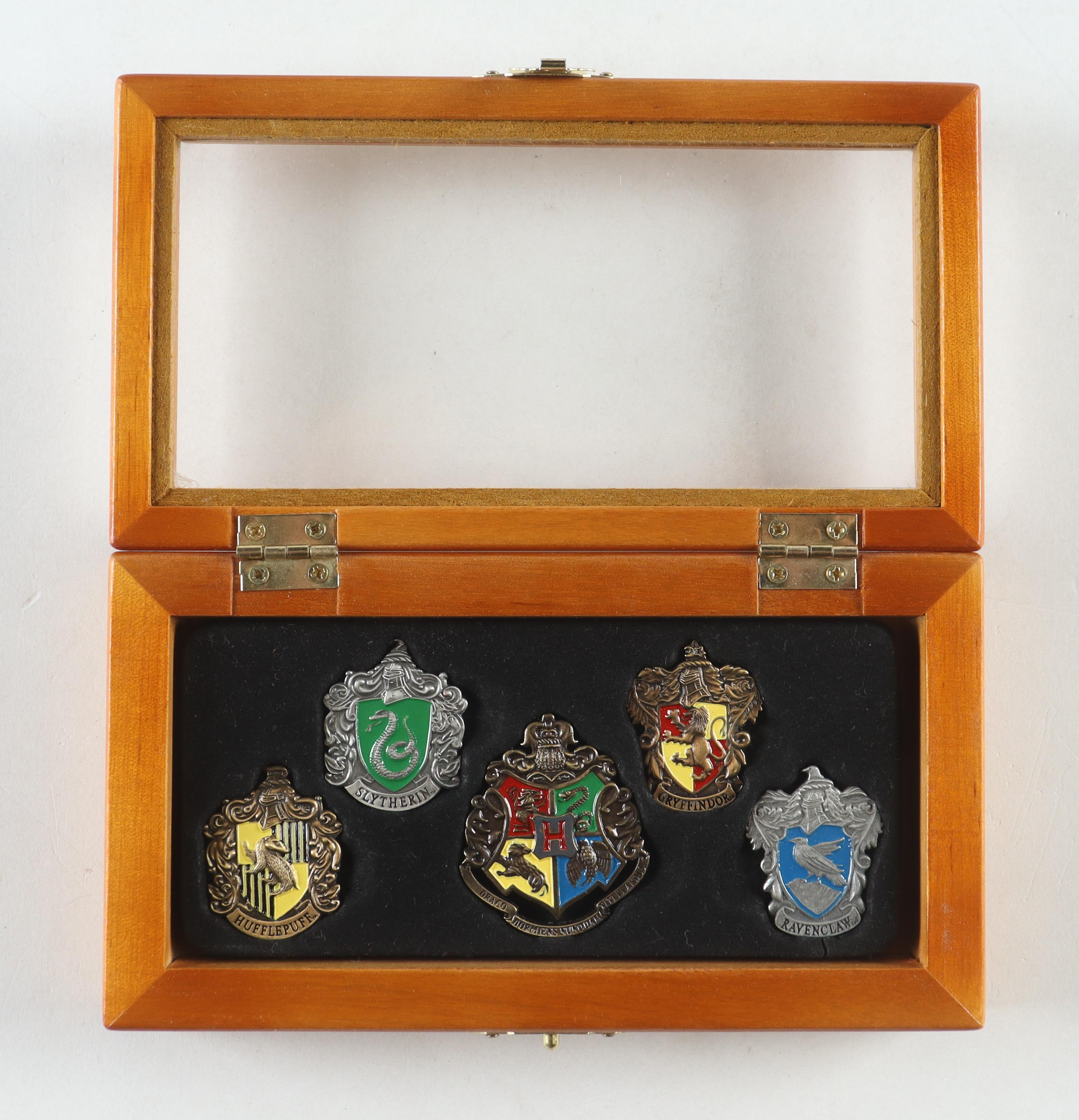 "Harry Potter" Warner Bros. Entertainment Set of (5) Pins with Wooden Display Case at PristineAuction.com "Harry Potter" Warner Bros. Entertainment Set of (5) Pins with Wooden Display Case at PristineAuction.com