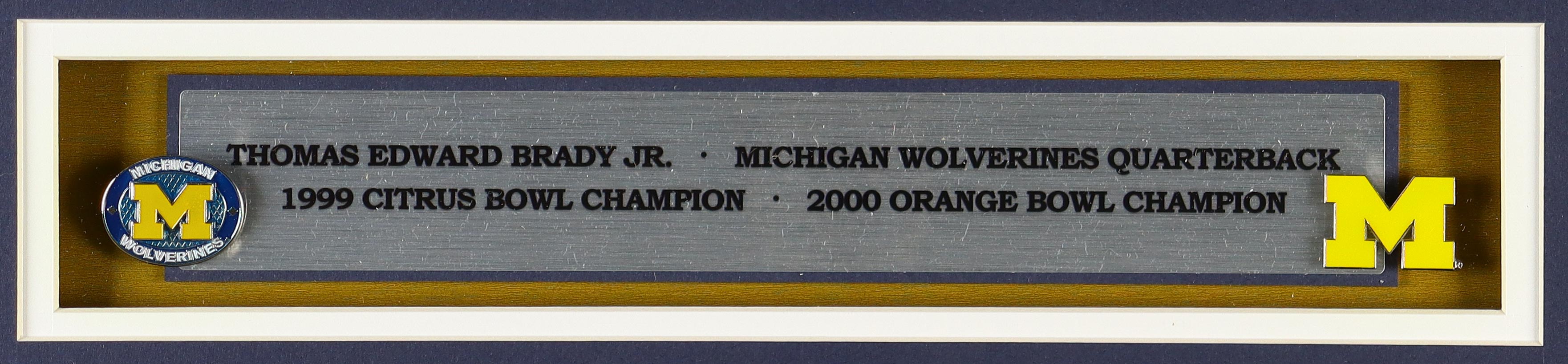 Tom Brady Michigan Wolverines Custom Framed Nike Air Jordan Jersey Display With (2) Team Logo Pins & (2) Cloth Patch Emblems at PristineAuction.com Tom Brady Michigan Wolverines Custom Framed Nike Air Jordan Jersey Display With (2) Team Logo Pins & (2) Cloth Patch Emblems at PristineAuction.com