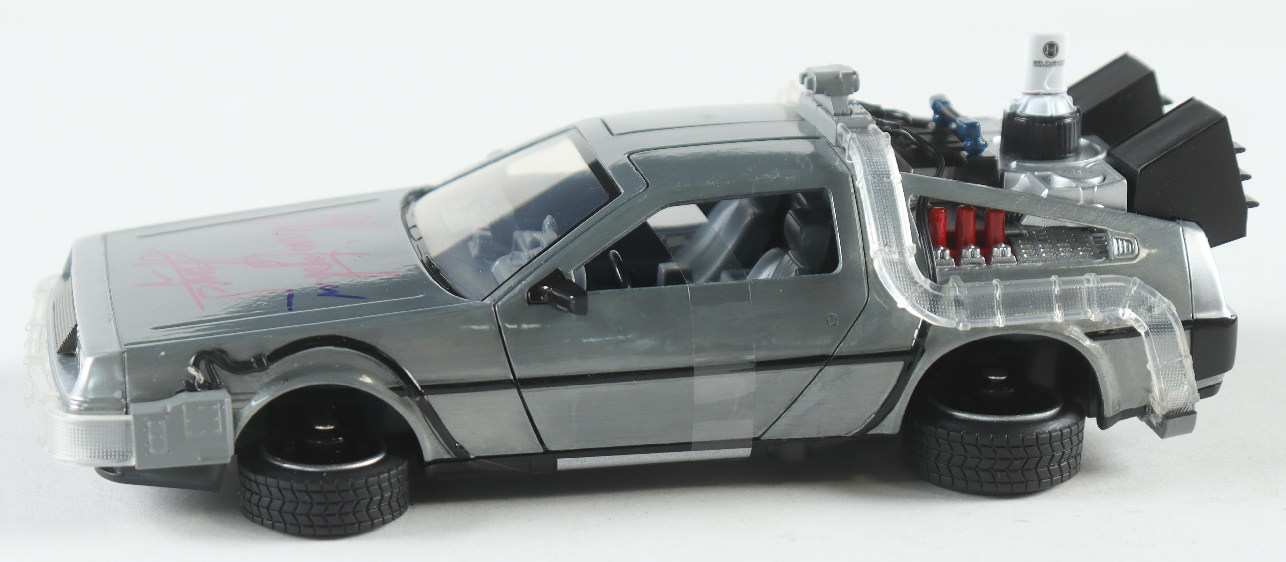 Christopher Lloyd Signed "Back to the Future" DeLorean Time Machine 1:24 Scale Die-Cast Car (Beckett) at PristineAuction.com Christopher Lloyd Signed "Back to the Future" DeLorean Time Machine 1:24 Scale Die-Cast Car (Beckett) at PristineAuction.com