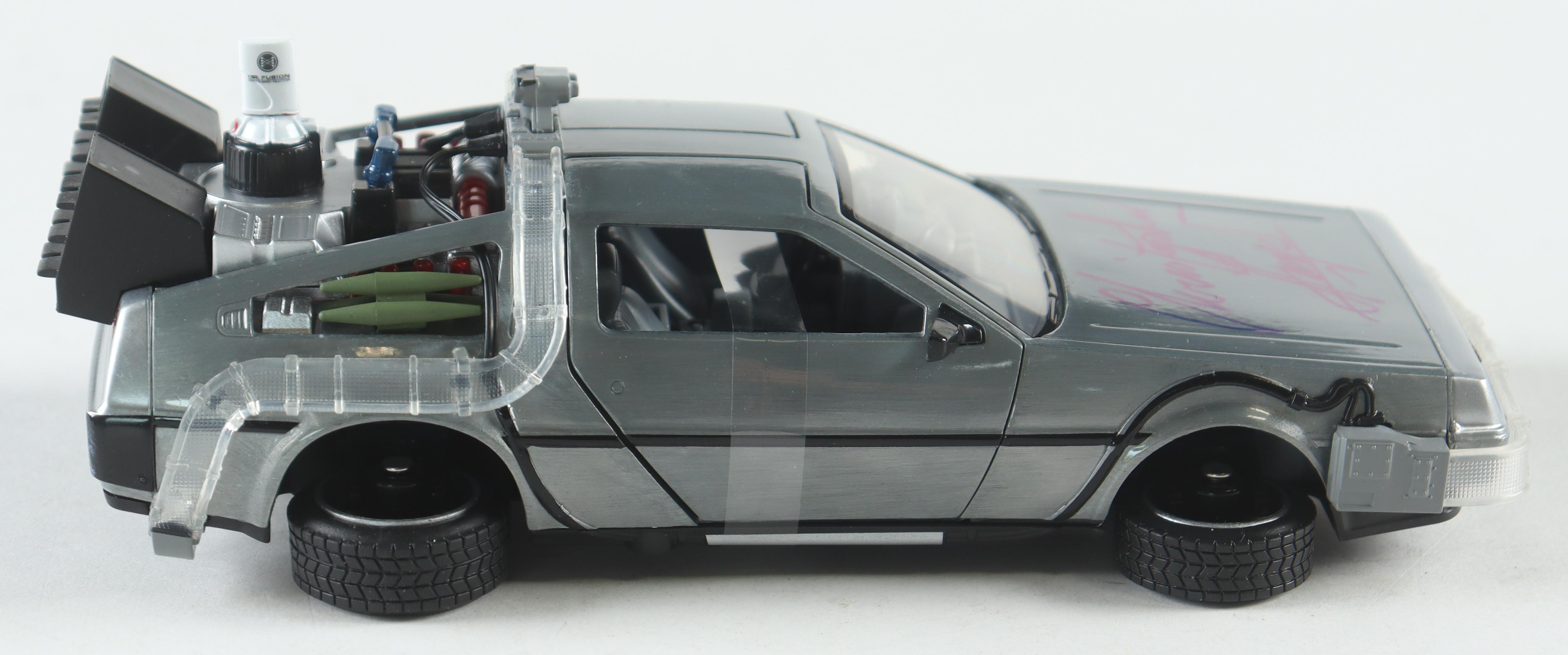 Christopher Lloyd Signed "Back to the Future" DeLorean Time Machine 1:24 Scale Die-Cast Car (Beckett) at PristineAuction.com Christopher Lloyd Signed "Back to the Future" DeLorean Time Machine 1:24 Scale Die-Cast Car (Beckett) at PristineAuction.com