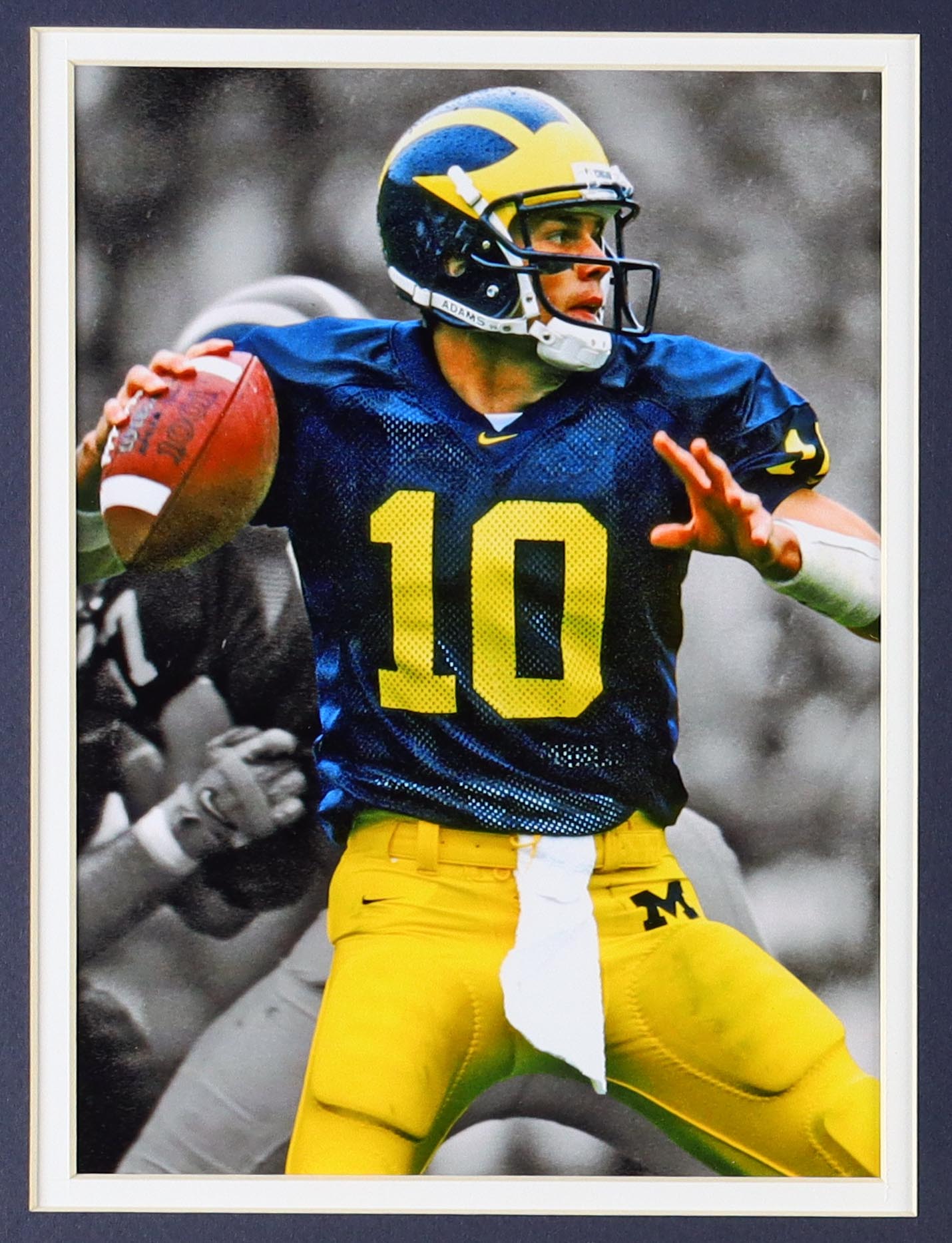 Tom Brady Custom Framed Jersey Display With Michigan Wolverines Metal Football Emblem & (2) Cloth Team Logo Patches at PristineAuction.com Tom Brady Custom Framed Jersey Display With Michigan Wolverines Metal Football Emblem & (2) Cloth Team Logo Patches at PristineAuction.com