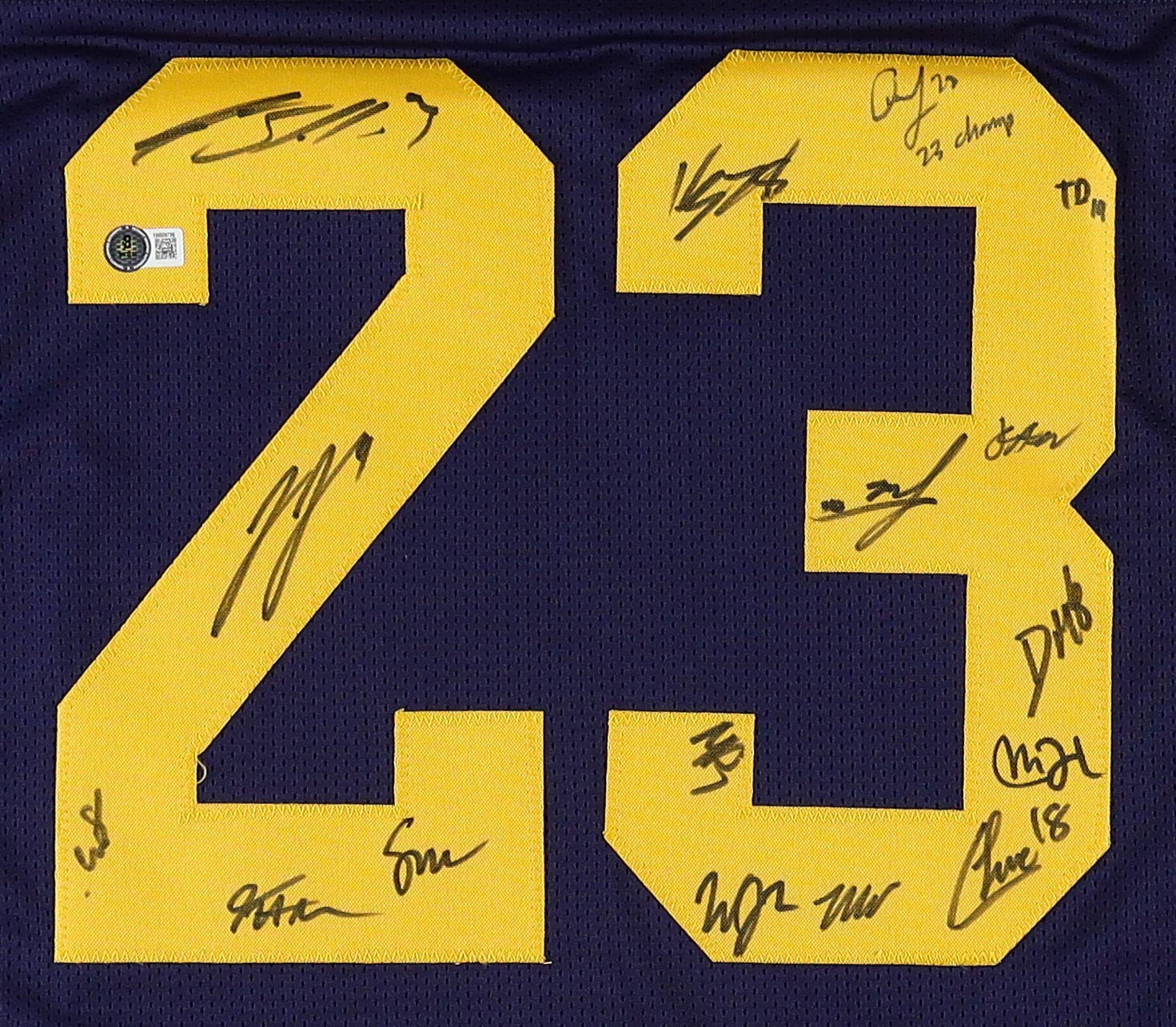 2023 Michigan Wolverines Jersey Team-Signed by (16) with J.J. McCarthy, Blake Corum, Colston Loveland, Mike Sainristil Inscribed "23 Champs" (Beckett) at PristineAuction.com 2023 Michigan Wolverines Jersey Team-Signed by (16) with J.J. McCarthy, Blake Corum, Colston Loveland, Mike Sainristil Inscribed "23 Champs" (Beckett) at PristineAuction.com