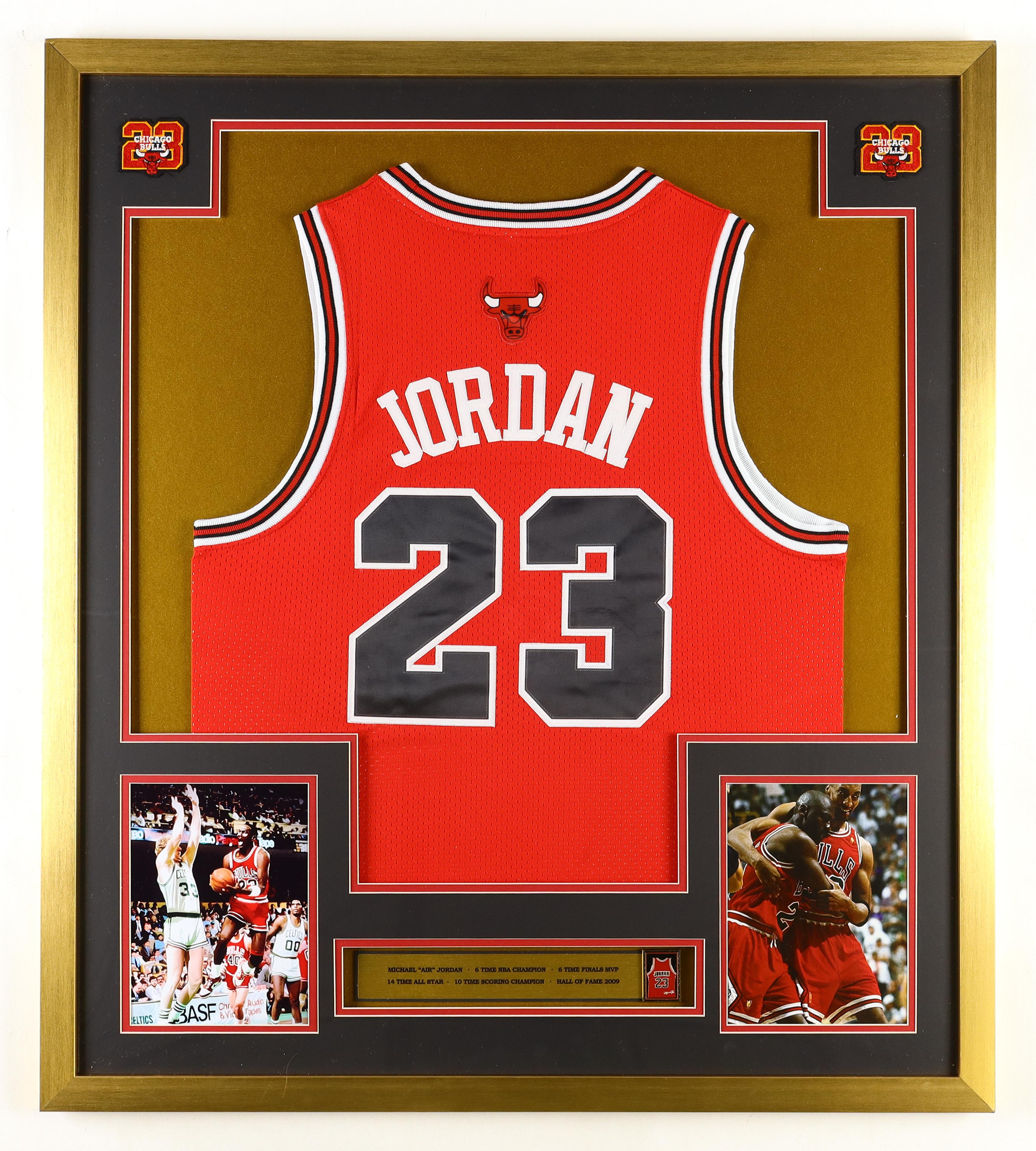 Michael Jordan Custom Framed Jersey Display with #23 Jersey Retirement Pin & (2) Cloth Player Number Logo Patches at PristineAuction.com Michael Jordan Custom Framed Jersey Display with #23 Jersey Retirement Pin & (2) Cloth Player Number Logo Patches at PristineAuction.com